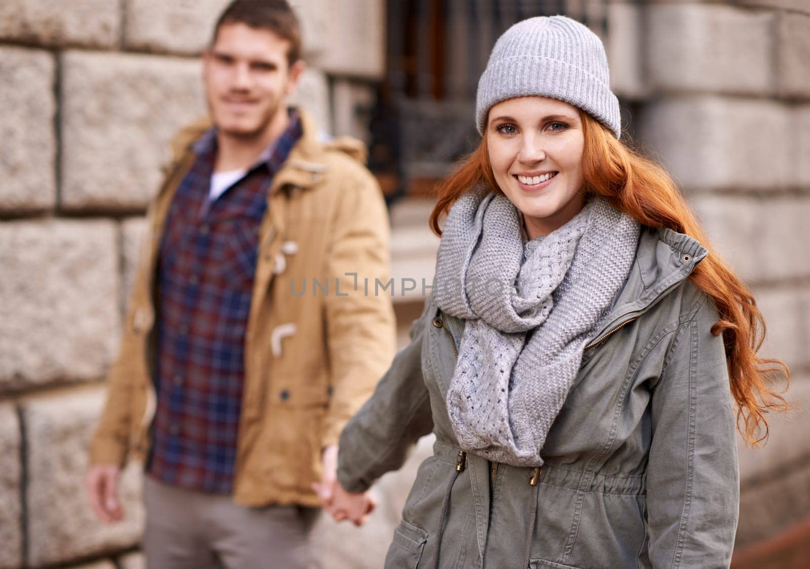 Couple, portrait and love with autumn, date and adventure for smile and happiness. Man, woman and romance with cozy, relationship and bonding with holiday or vacation for honeymoon with holding hands by YuriArcurs