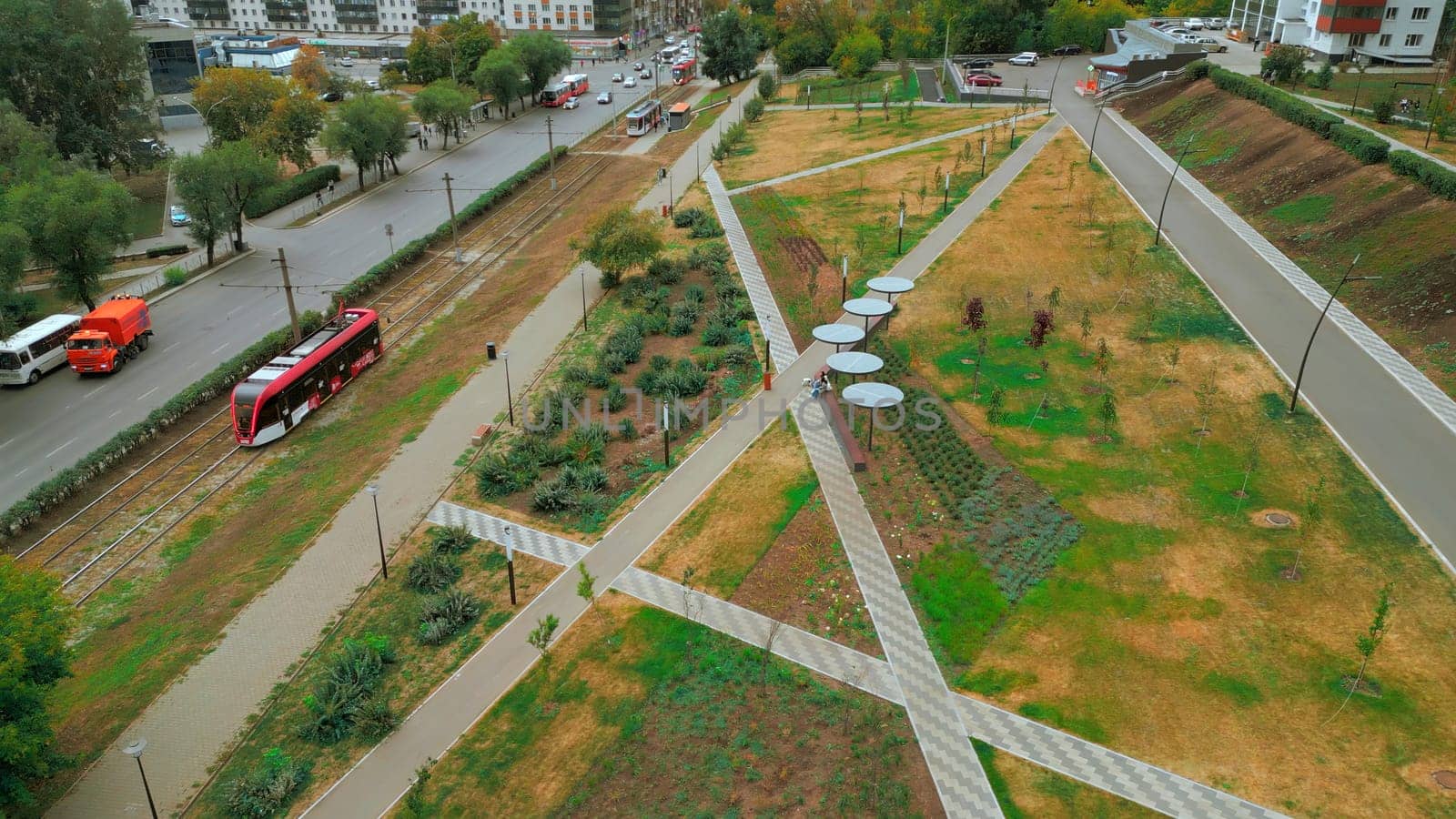 Top view of paths in park alley. Clip. Solar panels in park alley of city. Lines of paths in park city alley of residential area.