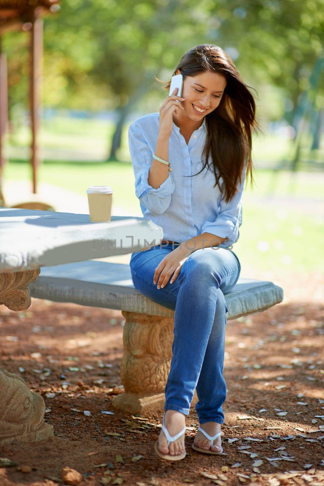 Woman, cellphone and phone call with smile, garden and nature with summer communication. Student, conversation and discussion with happiness, sunshine and rest with technology for speaking to people.