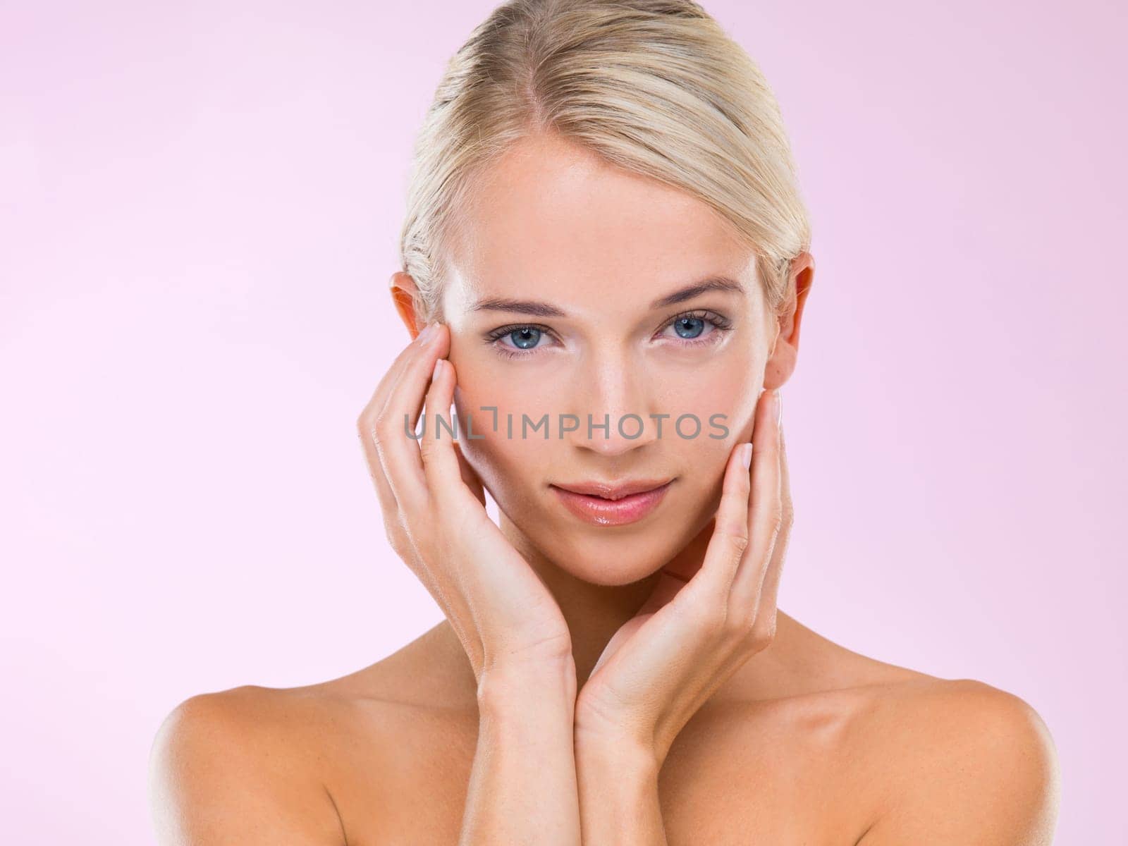 Woman, portrait and skincare cosmetics in studio for healthy treatment, pink background or confidence. Female person, face and hand for makeup beauty or dermatology wellness, selfcare or mockup space.