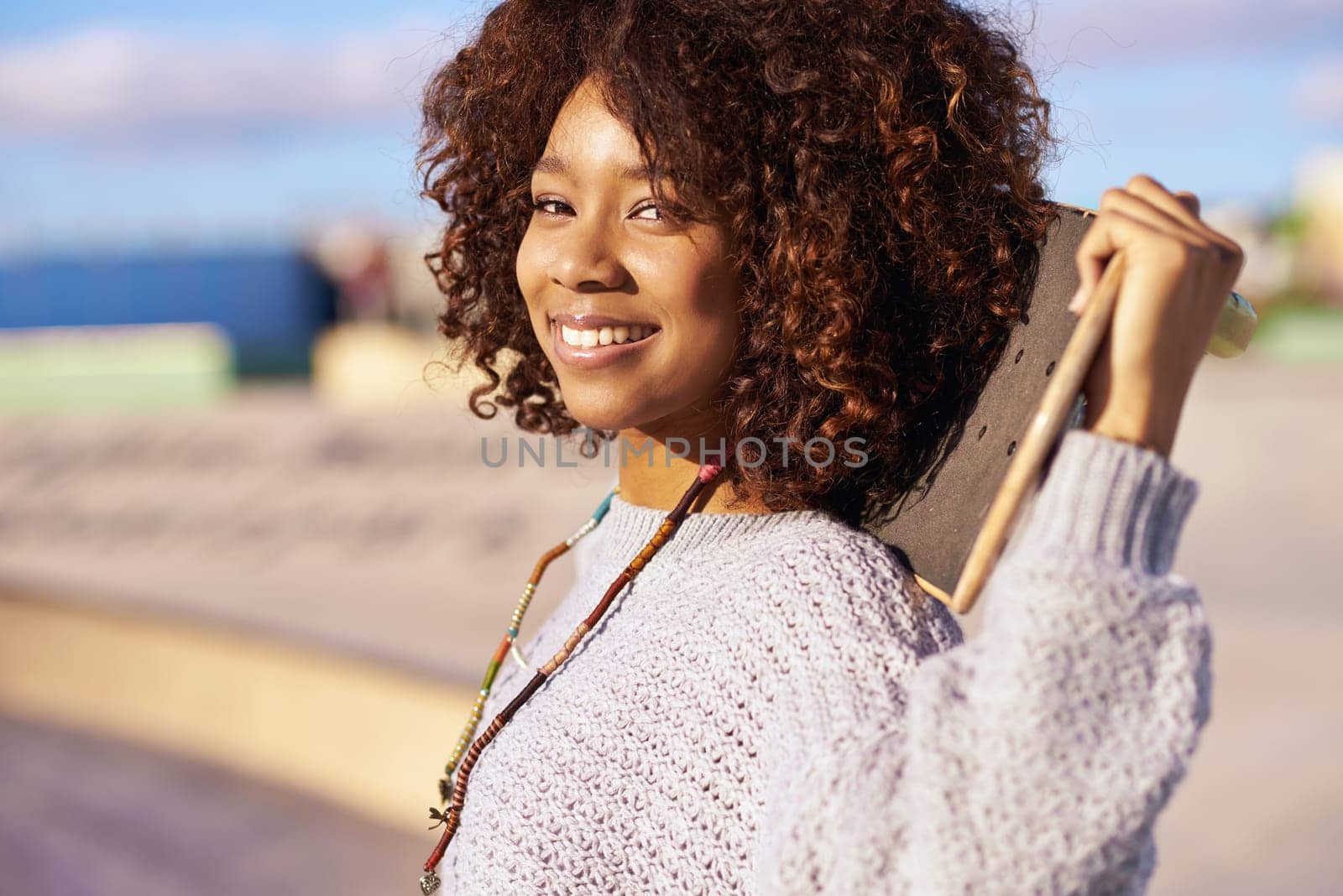 Portrait, happy woman and skateboard on street in city in summer for sport, health and exercise outdoor. Face, skate park and smile of person or girl in casual clothes for fashion in South Africa.