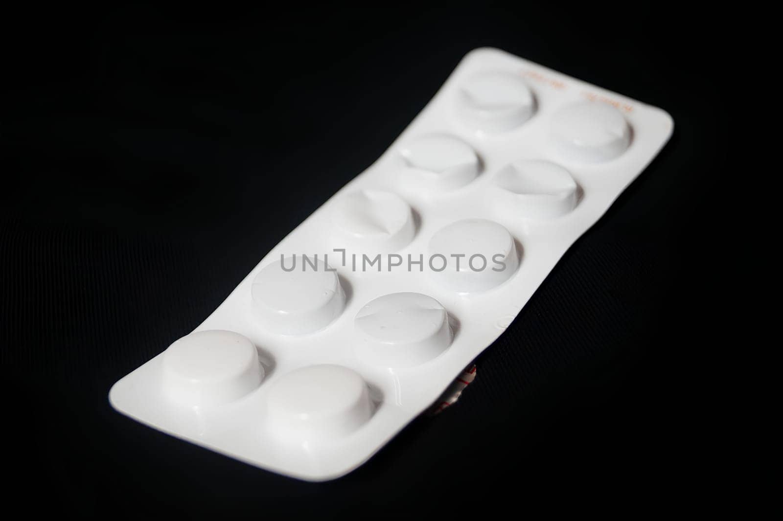 A white pill bottle with a white pill inside. High quality photo