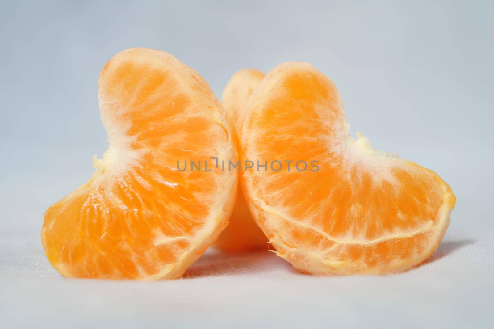A close up of an orange with the top half cut off. High quality photo