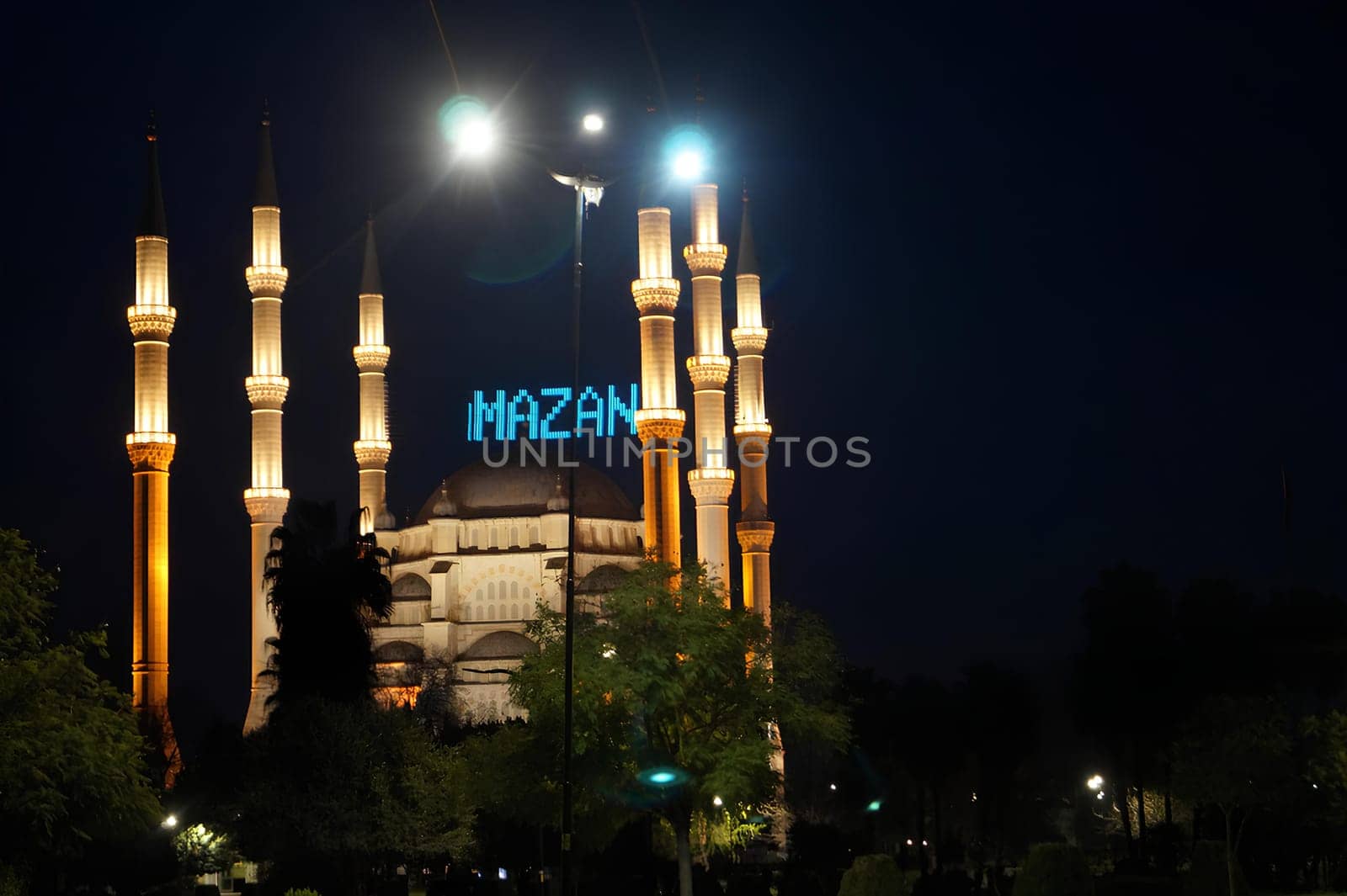 A large mosque with a blue sign. High quality photo