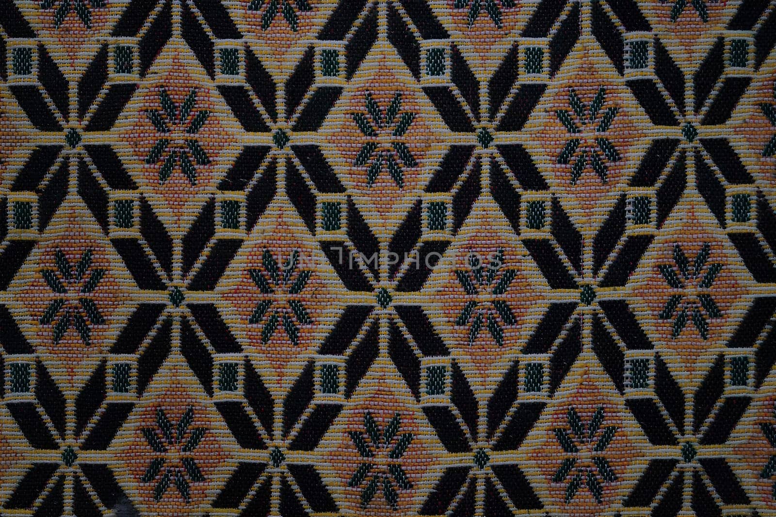 A patterned carpet with a black and brown color scheme. High quality photo