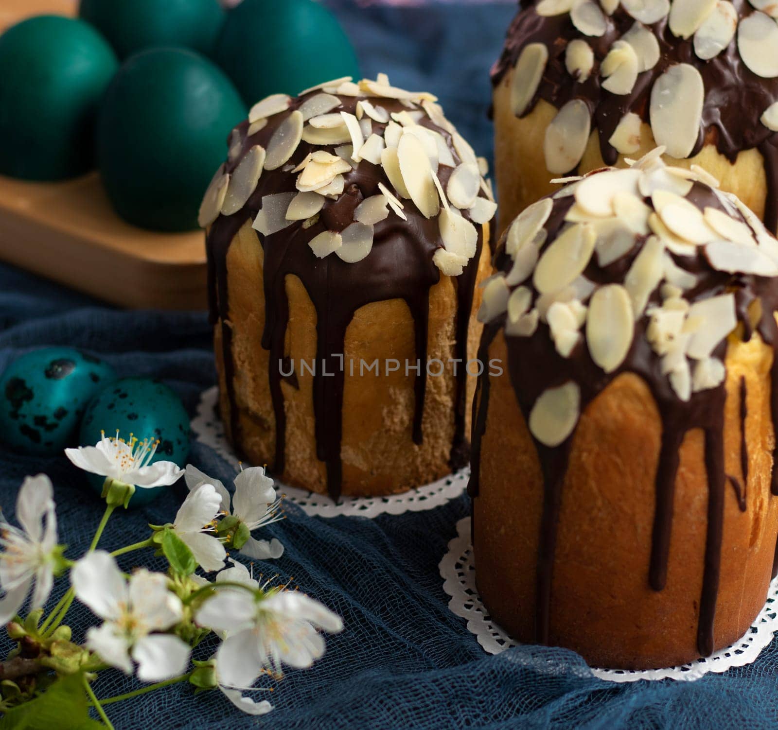 traditional Easter baking. Bun with chocolate and almond flakes. Selective focus. Sweet bread with chocolate. Special holiday baking decorated. High quality photo