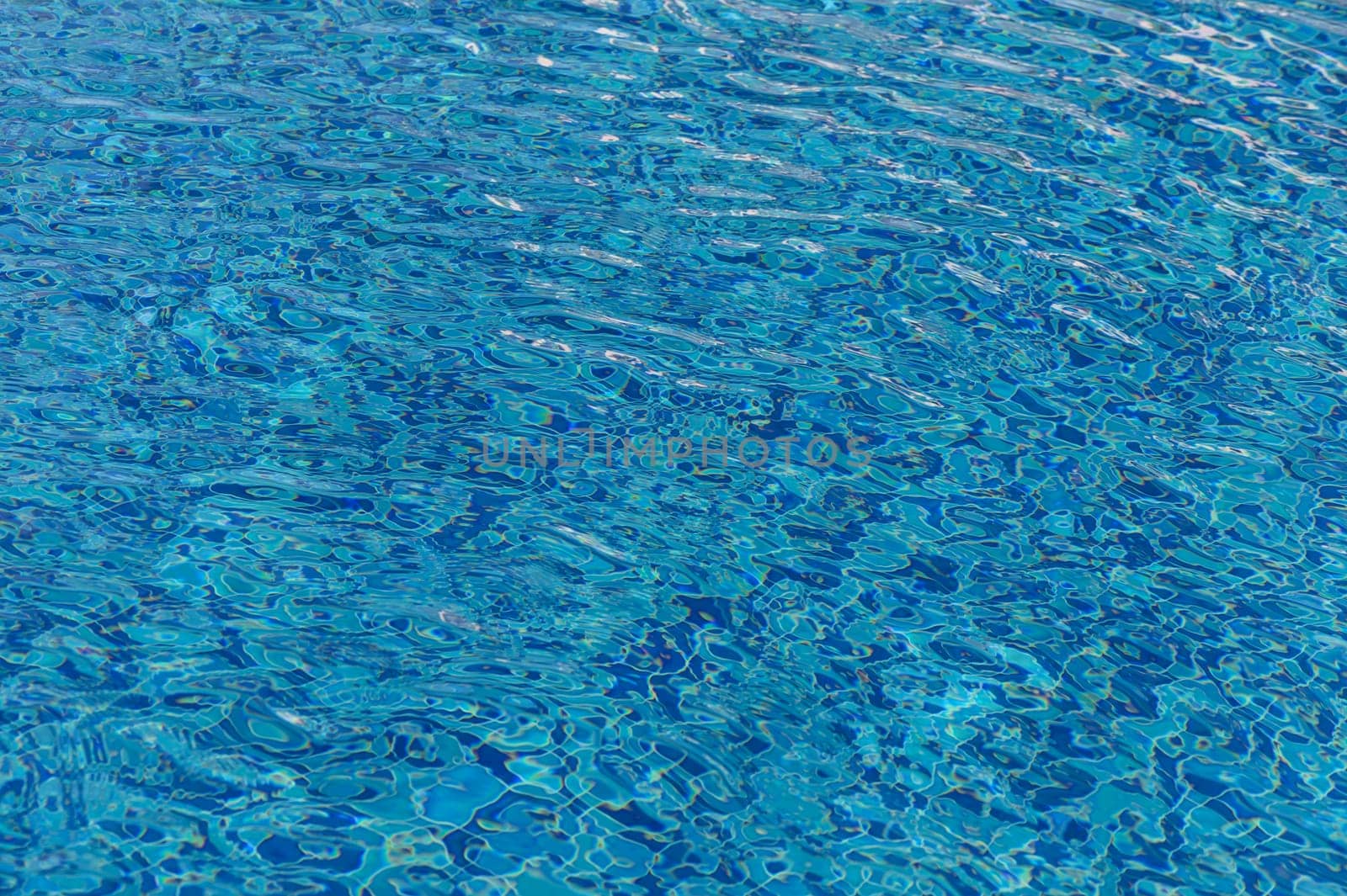 Ripple Water in swimming pool with sun reflection 8