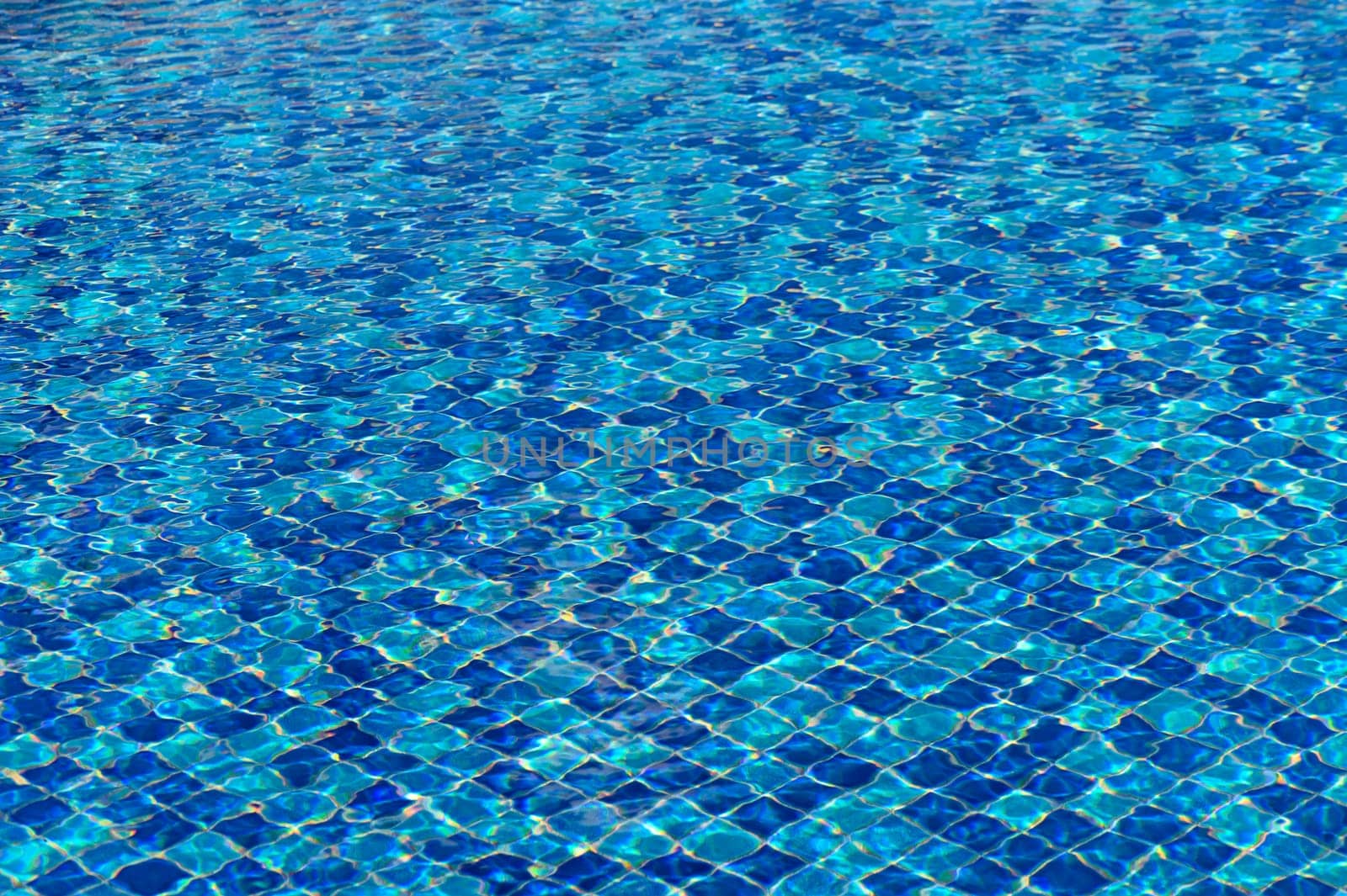 Ripple Water in swimming pool with sun reflection 7