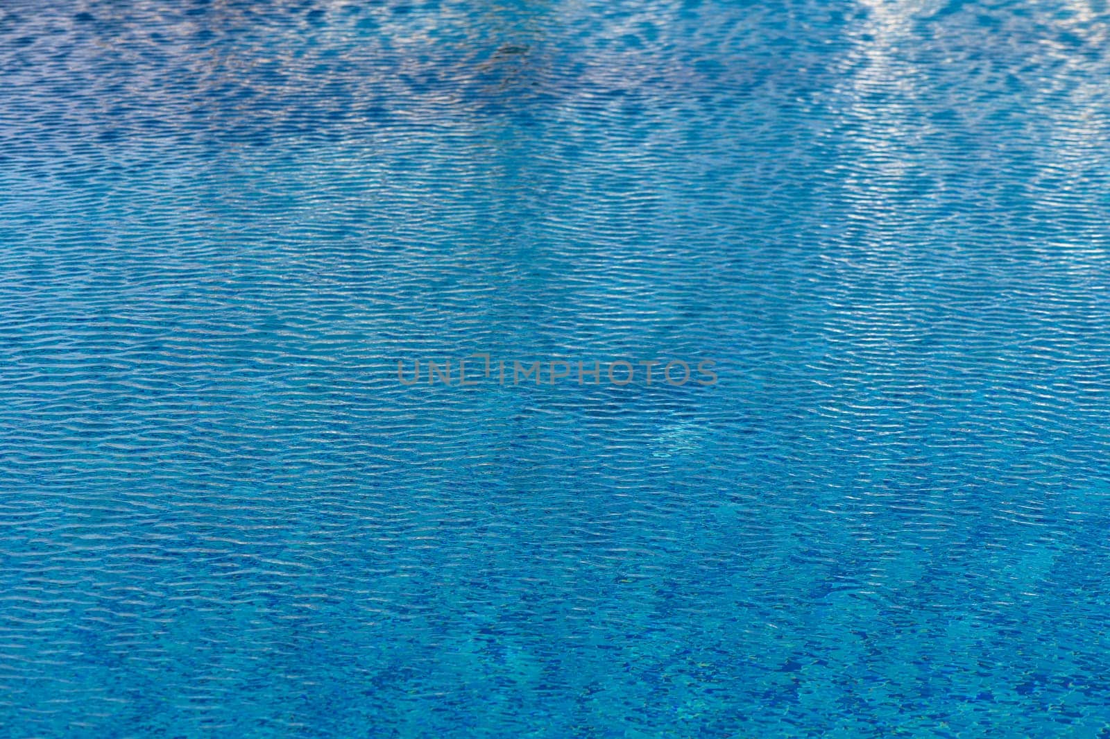 Ripple Water in swimming pool with sun reflection 5