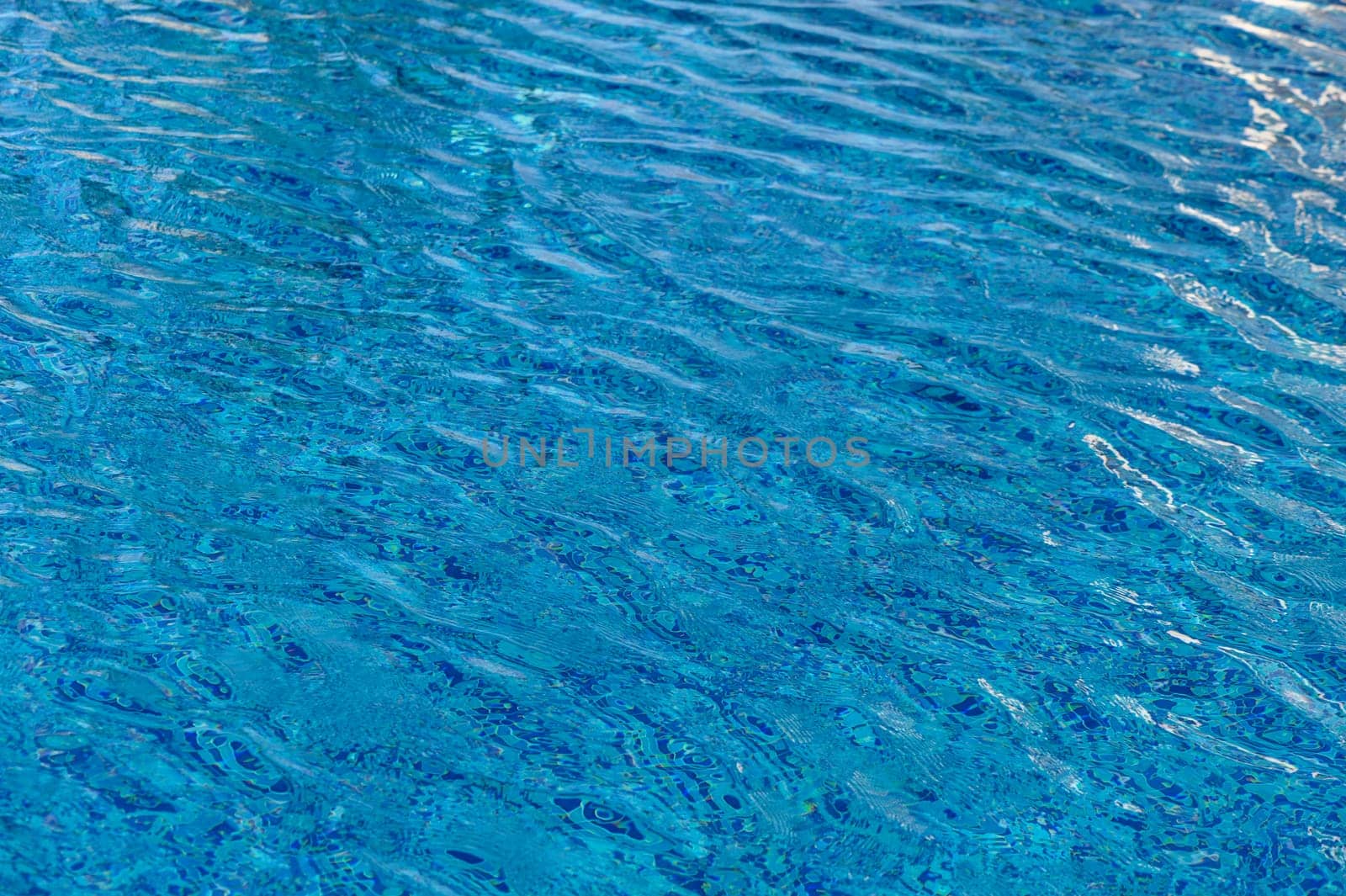 Ripple Water in swimming pool with sun reflection 6