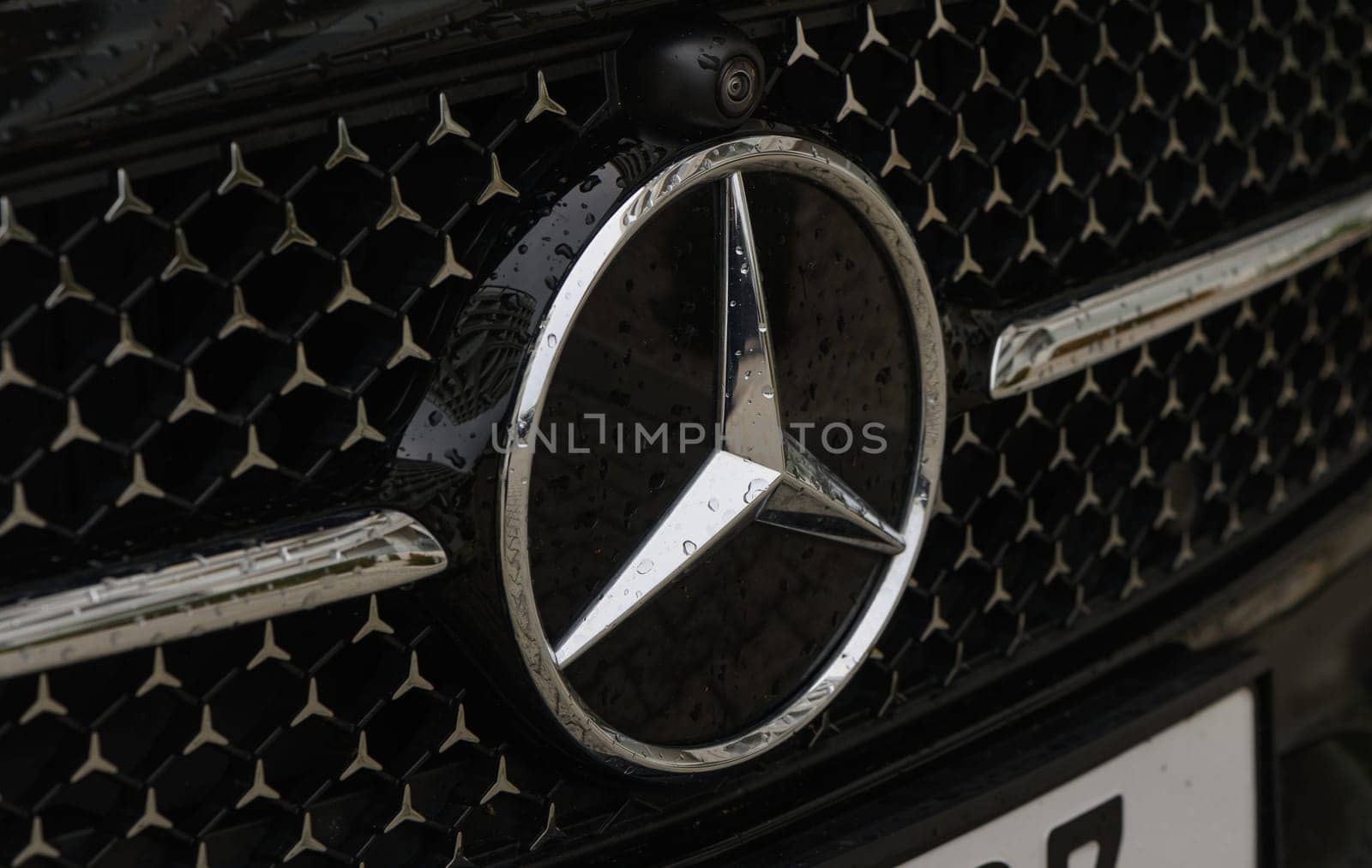 Gaziveren Cyprus 03.20.2024 - Mercedes logo on a black background with raindrops by Mixa74