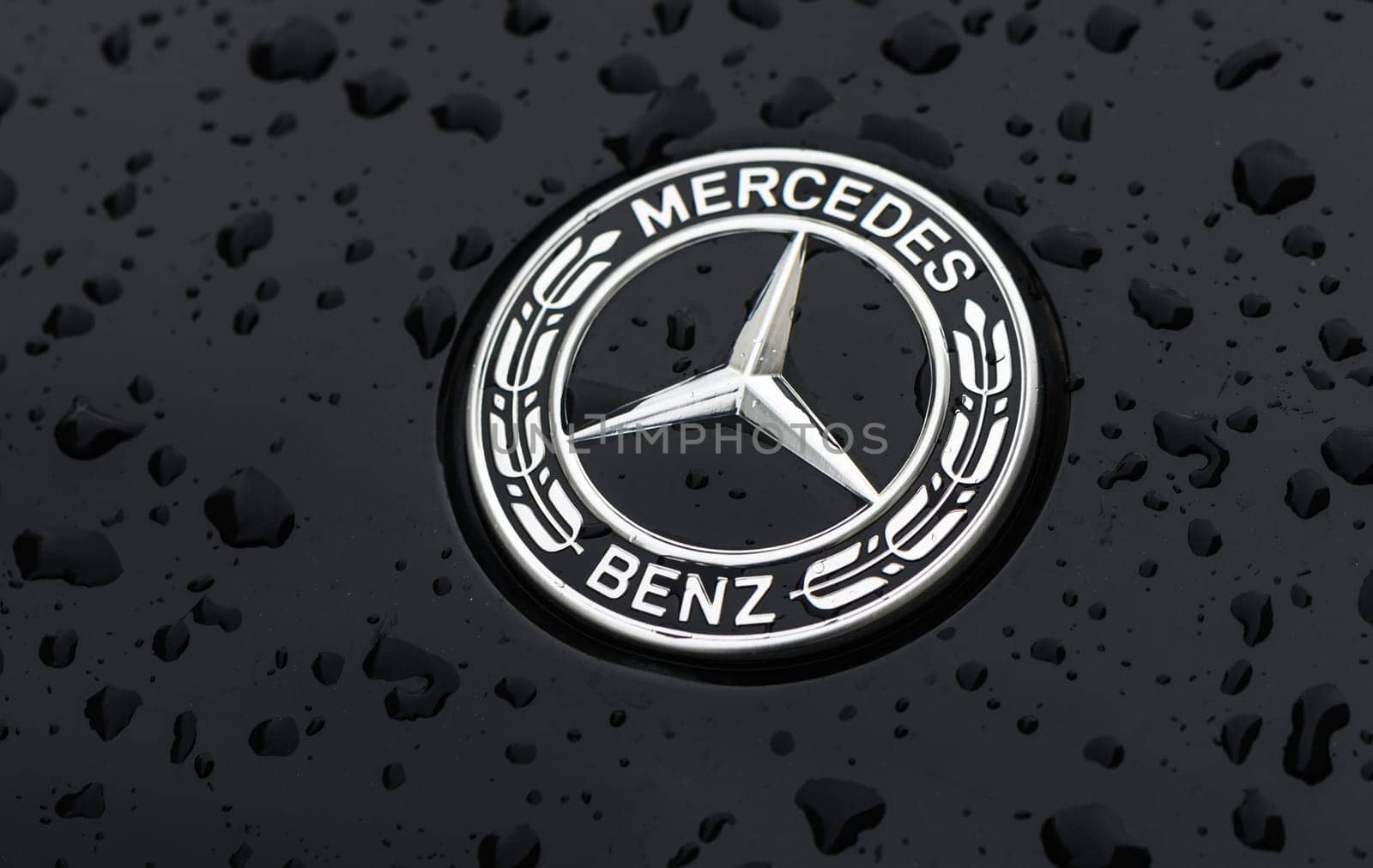 Gaziveren Cyprus 03.20.2024 - Mercedes logo on a black background with raindrops