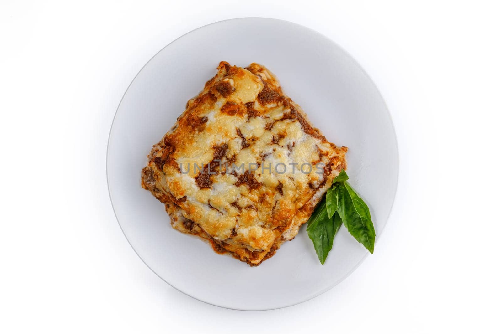 Tasty serving of traditional Italian lasagne with spicy tomato based ground beef and melted mozzarella cheese between layers of noodles 1