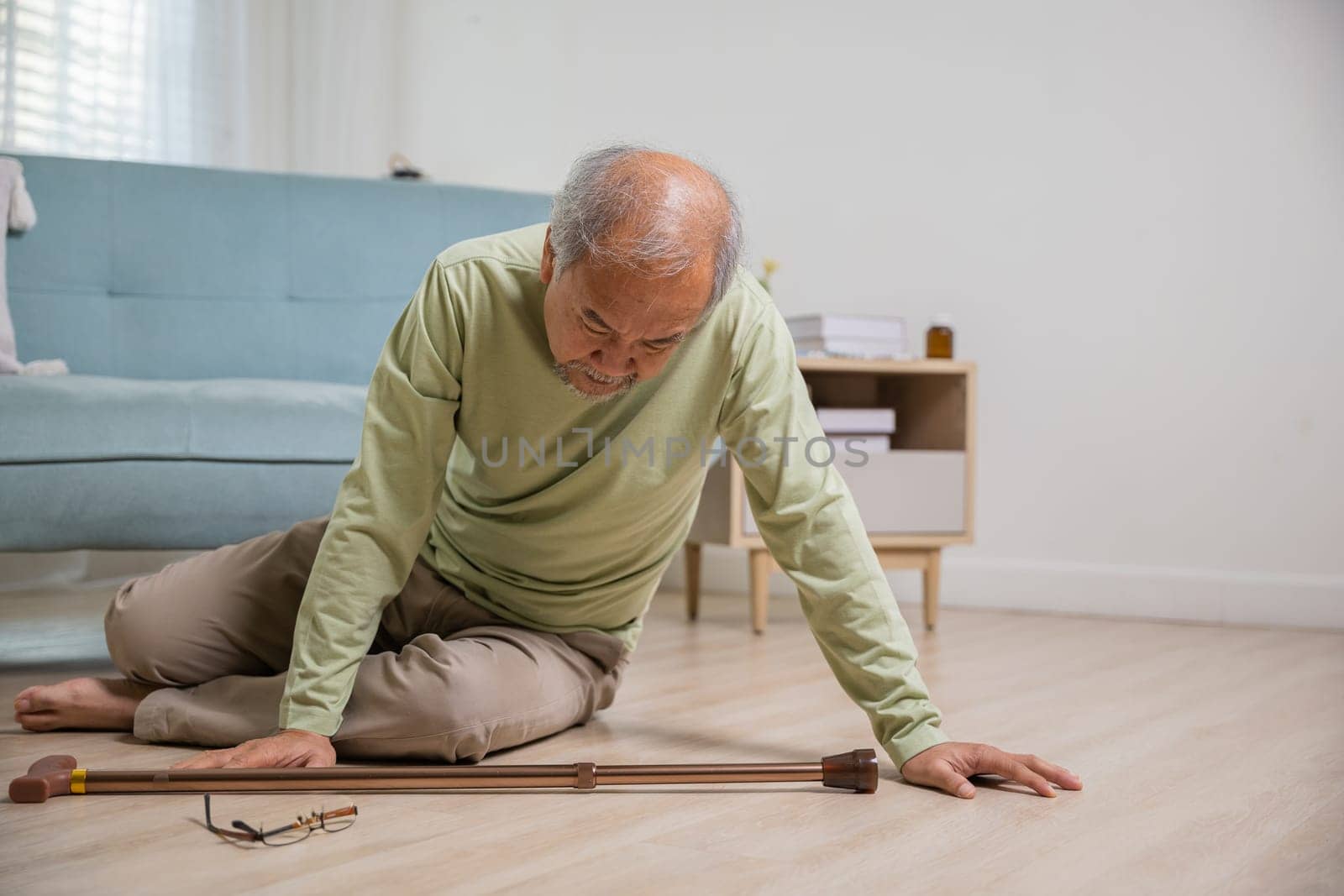 Asian elderly man retired headache after fall down by Sorapop