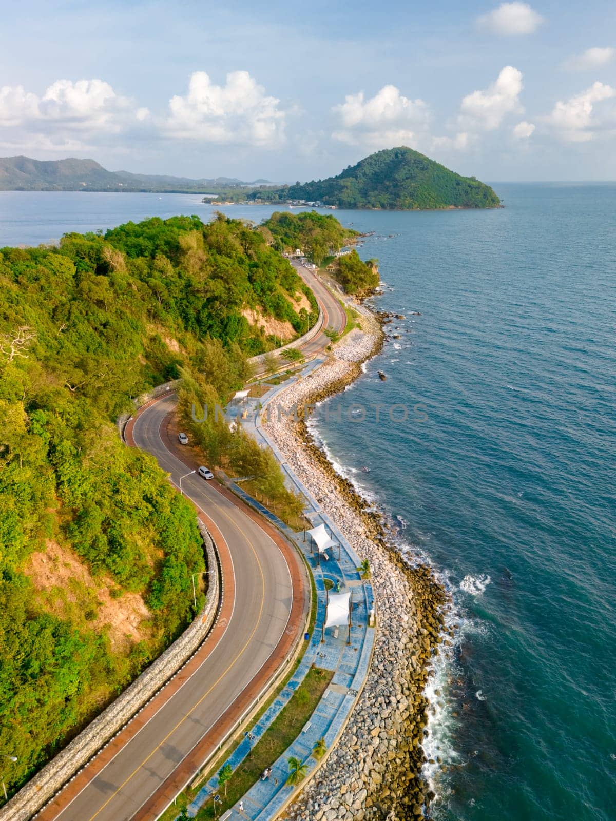 car driving on the curved road of Thailand. road landscape in summer. it's nice to drive on the beachside highway. Chantaburi Province Thailand,