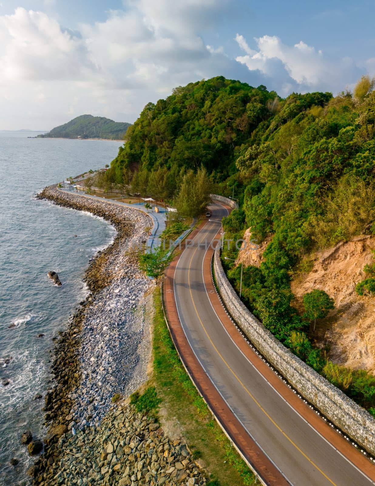 car driving on the curved road of Thailand. road landscape in summer. it's nice to drive on the beachside highway. Chantaburi Province Thailand,