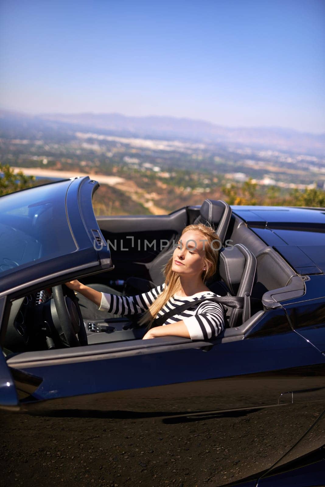 Woman, relax and drive in sports car for road trip in summer or adventure on vacation in Beverly Hills. Luxury vehicle for speed on highway, transportation and mountain for journey or freedom. by YuriArcurs