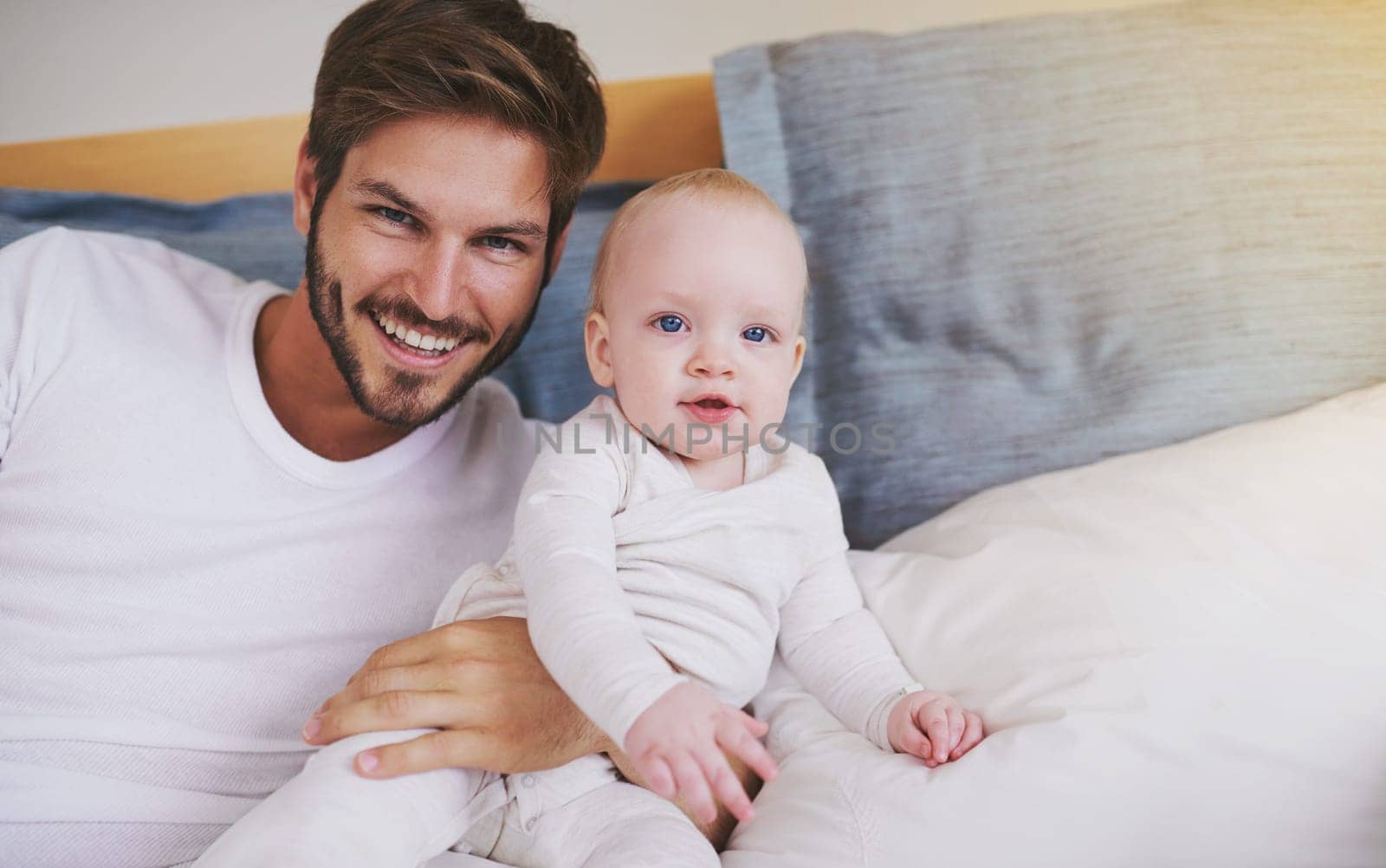 Bedroom, happy and portrait of father with baby for bonding, relationship and love for parenting. Family, home and dad with newborn infant on bed for child development, support and childcare in house.