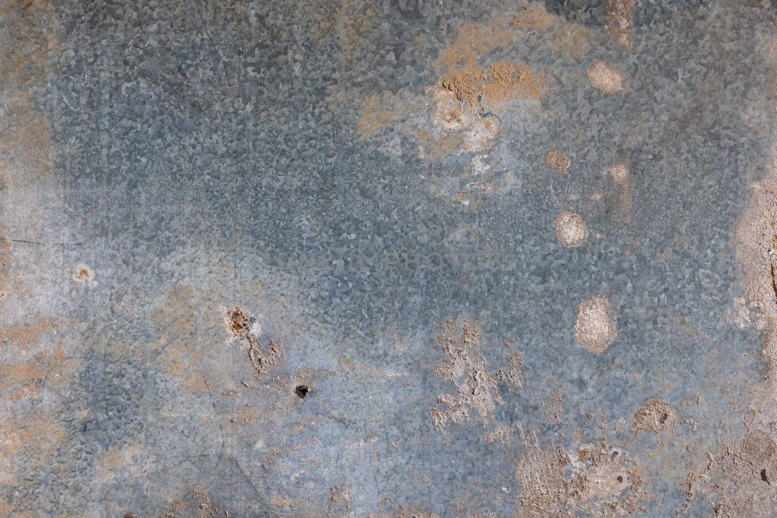 old dirty zinc coated sheet metal with cement stains - full-frame texture and background