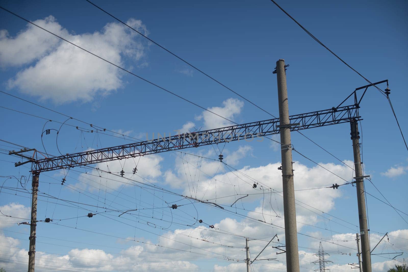 overhead power lines providing to electric trains - image