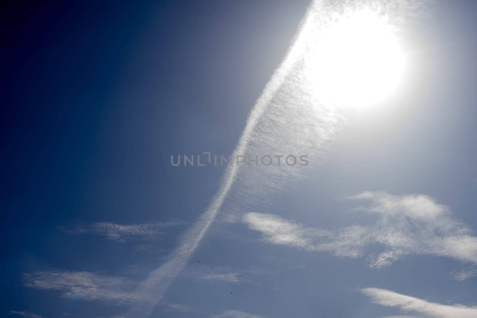 White spindrift clouds on blue sky, background - image