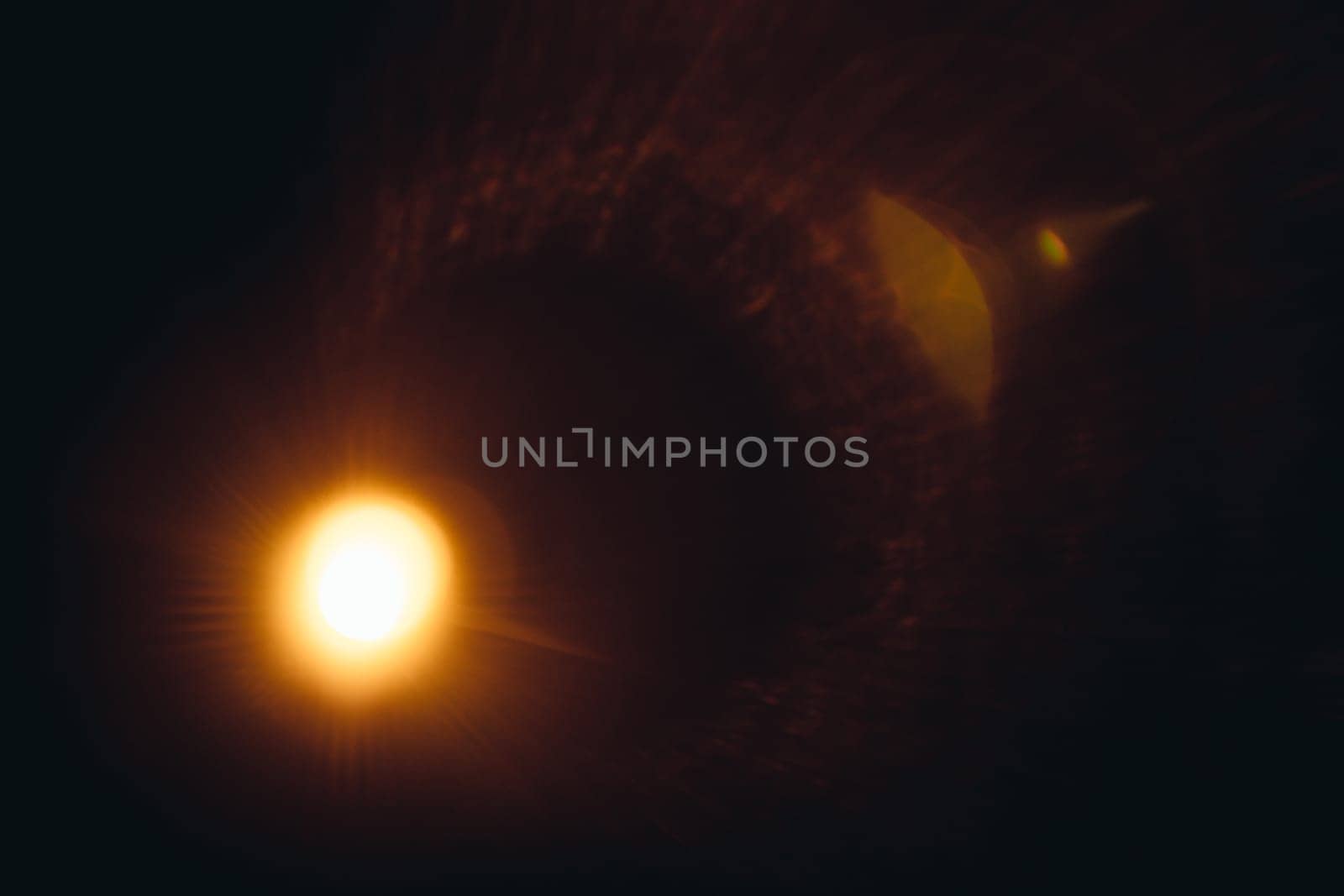 Abstract Natural Sun flare on the black.