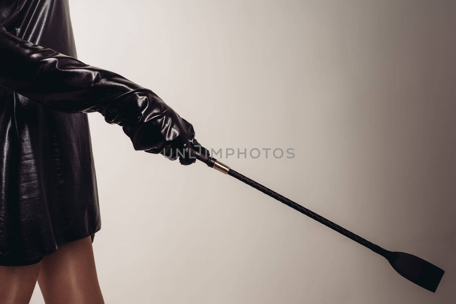 Sexy Lady Holding Strict Leather Short Handle Wide Head Riding Crop - image