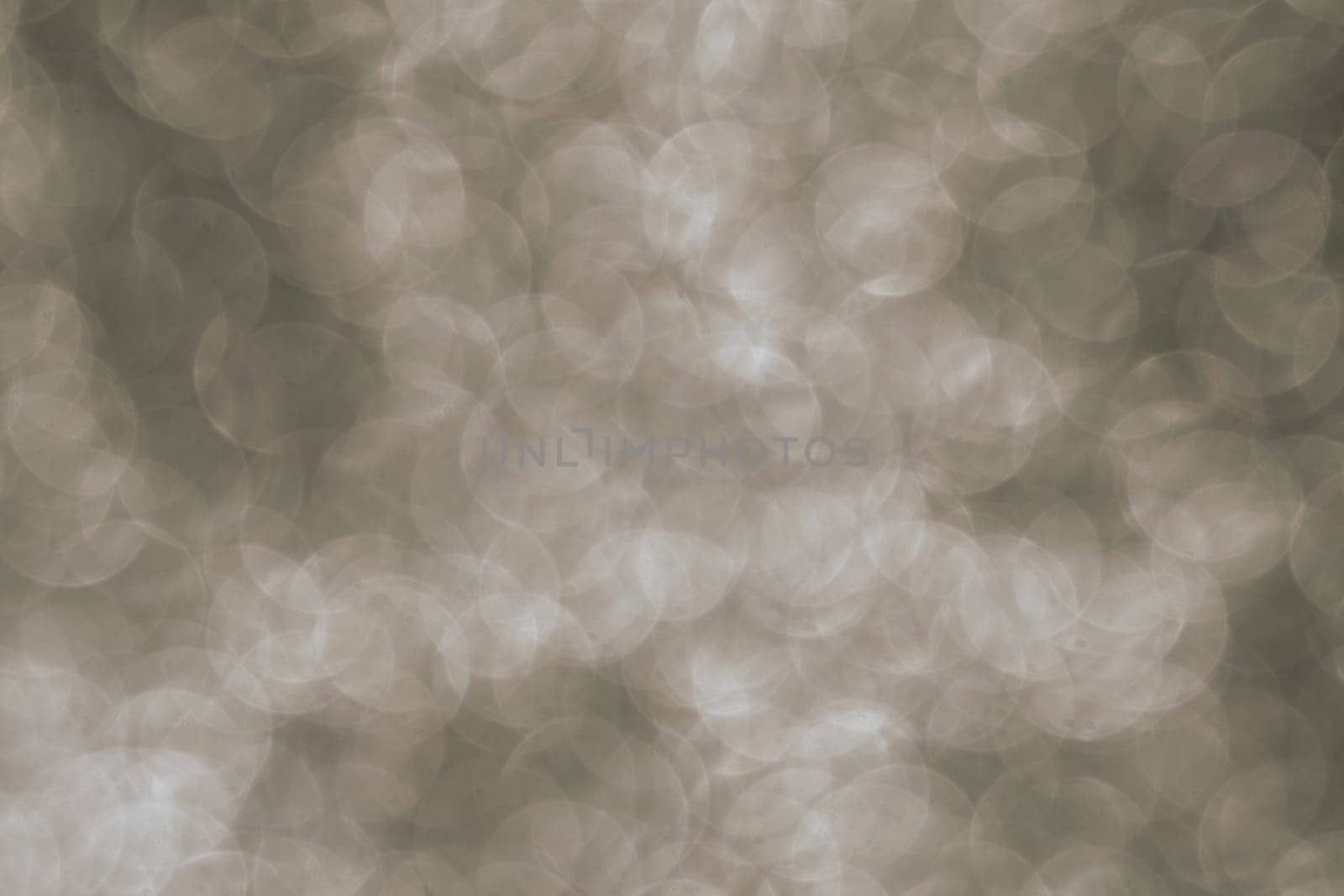 Silver Sparkling Lights Festive background with texture. Abstract Christmas twinkled bright bokeh defocused and Falling stars. Winter Card or invitation