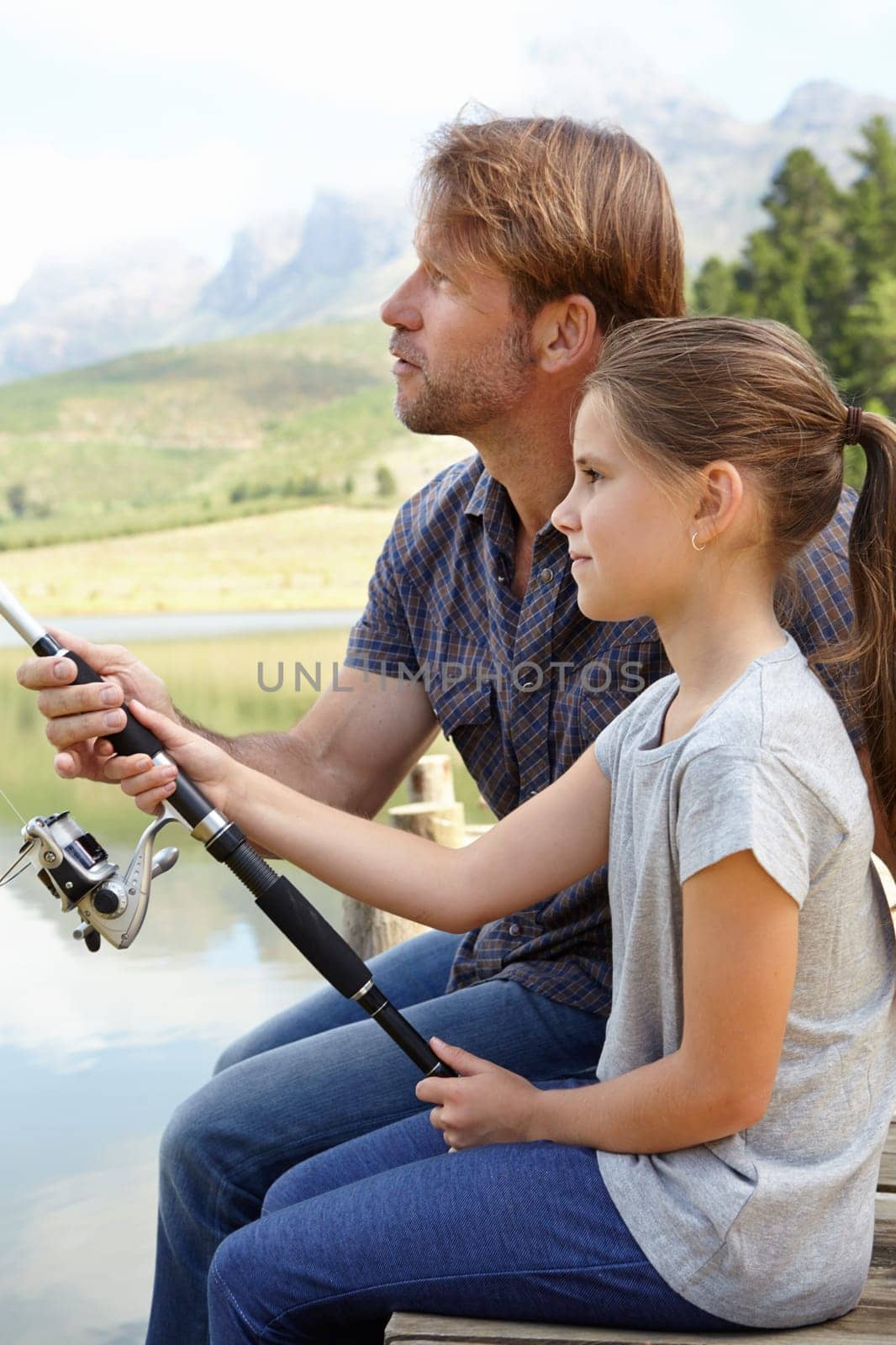 Dad, child and fishing in nature for teaching, learning and outdoor with holiday, travel or sustainable living. Family, father or fisherman with girl or kid by river, water or lake for adventure by YuriArcurs