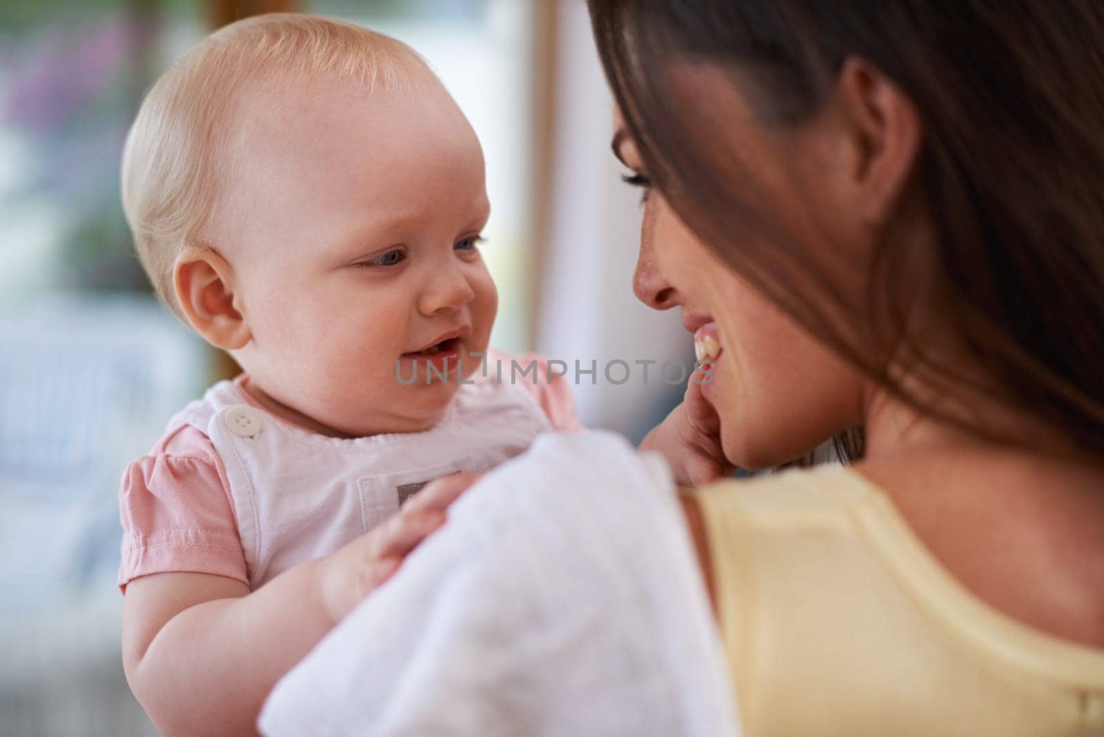 Happy, love and mother with baby in home for bonding, relationship and care for motherhood. Family, parenting and mom carrying newborn infant for child development, support and affection in house.