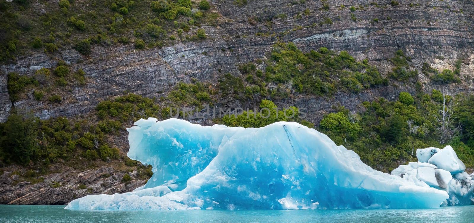 Majestic Blue Iceberg Floating in a Pristine Lake by FerradalFCG