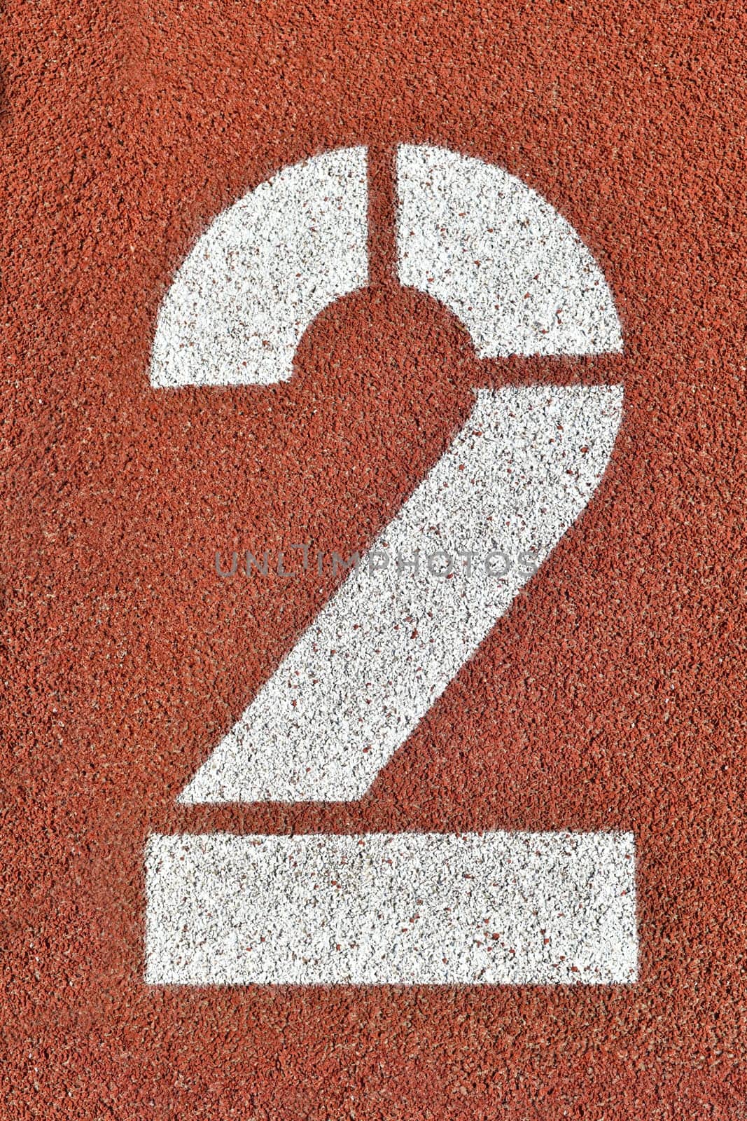 Number two on a red runway is numbered at a stadium by Godi