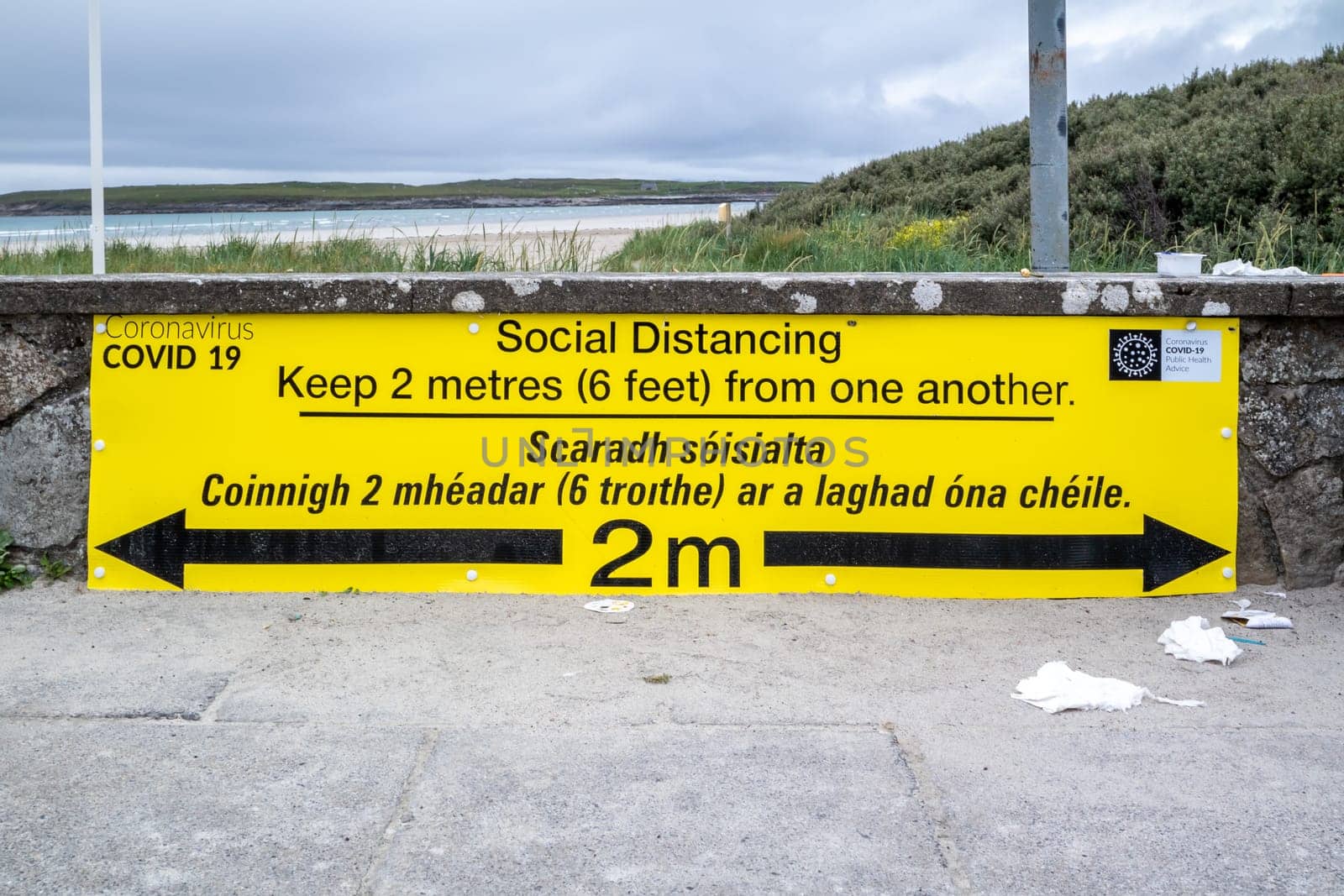 PORTNOO, COUNTY DONEGAL, IRELAND - JUNE 17 2020: Sign explaining the 2m social distancing rule at the beach.