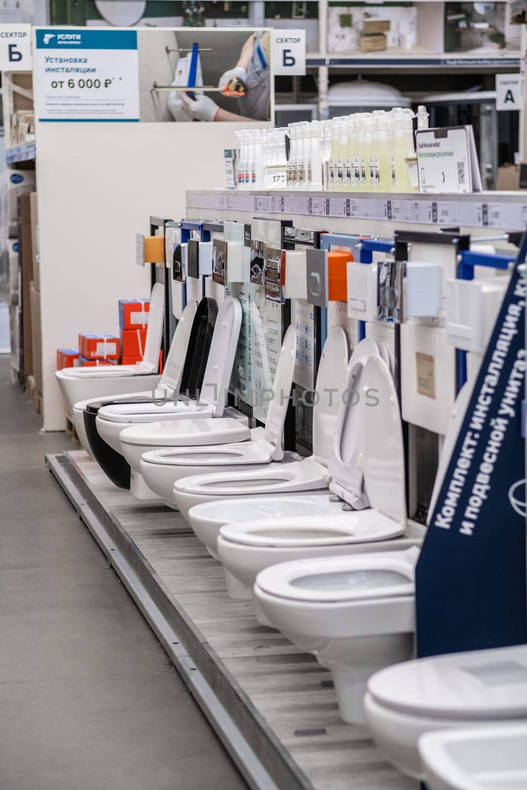 Moscow, Russia, March 3, 2024. A row of porcelain toilets is neatly lined up in the stores tableware section, showcasing the latest in engineering and serveware technology