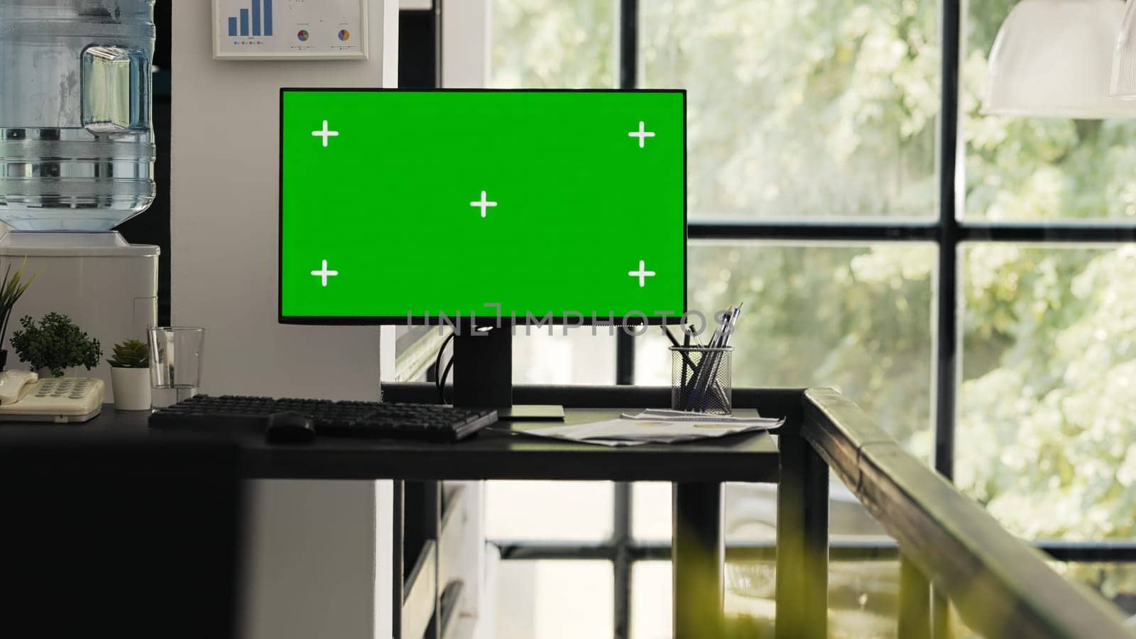 Empty office with greenscreen desktop by DCStudio