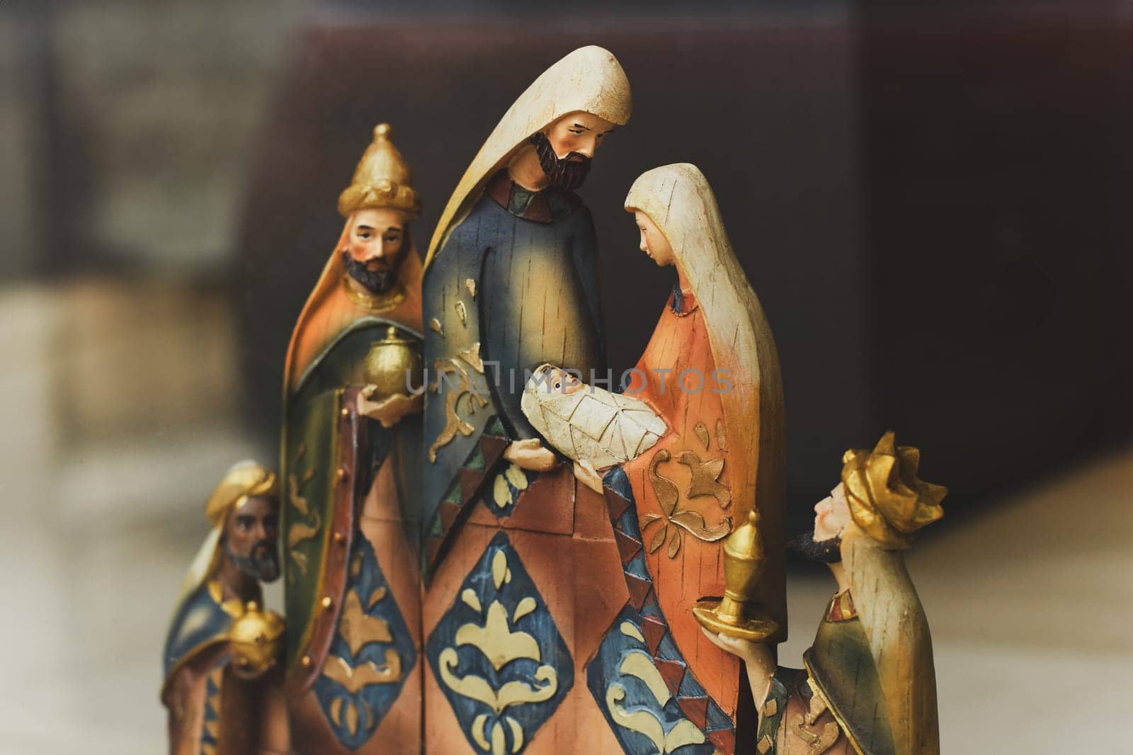 Wooden figurines of Joseph, Mary, Jesus of a nativity scene Christmas creche