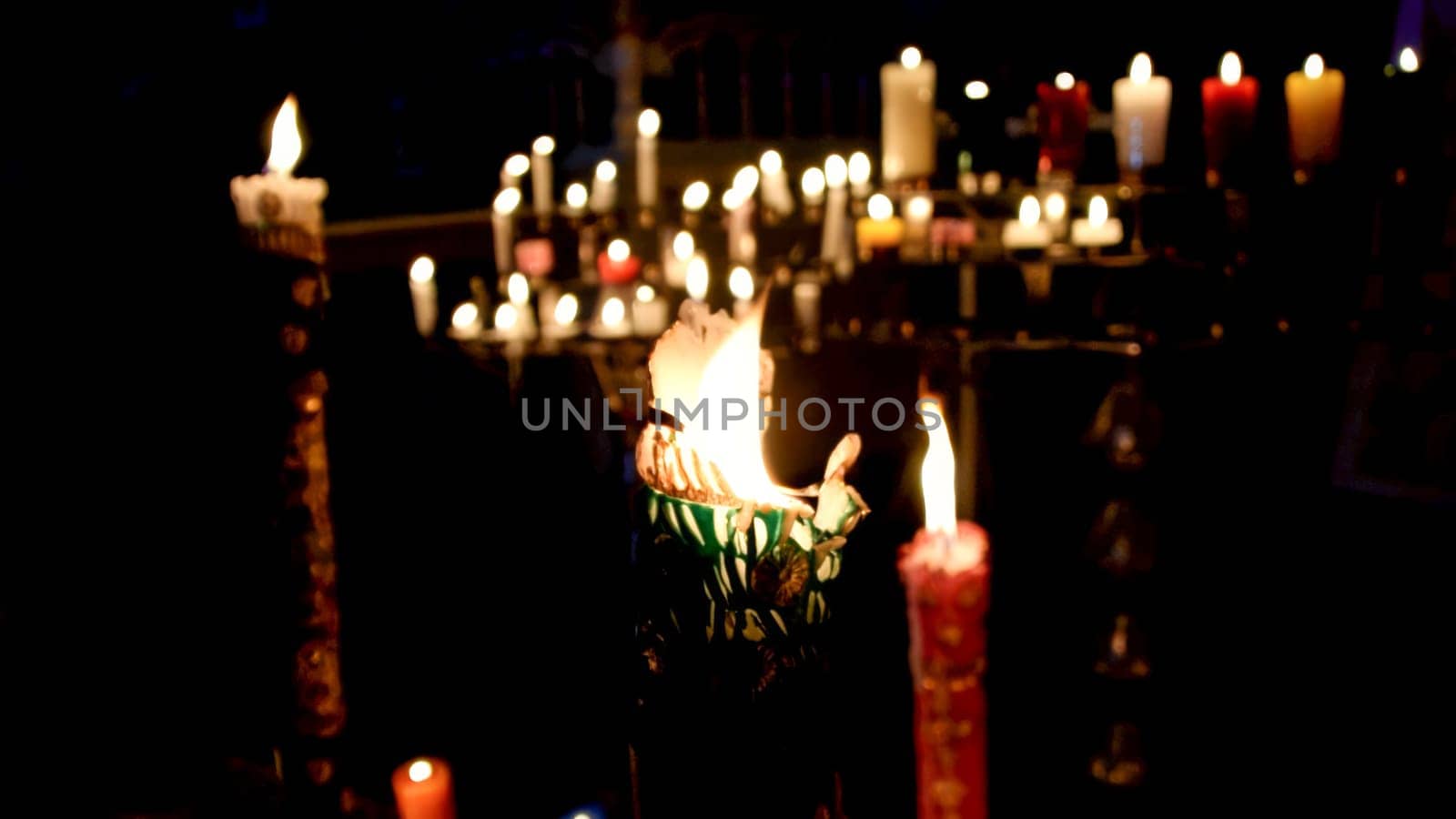 Illuminated candles in dark ambiance by Peruphotoart