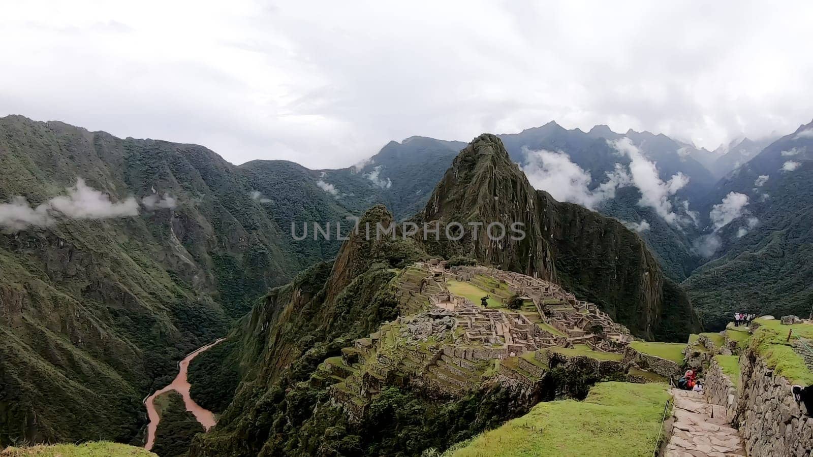 Scenic view of ancient inca citadel machu picchu amidst andean mountains and clouds