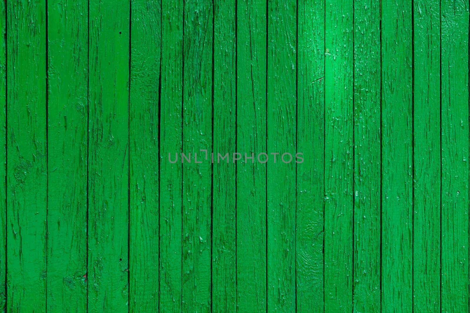 green paint wooden planks fence texture.