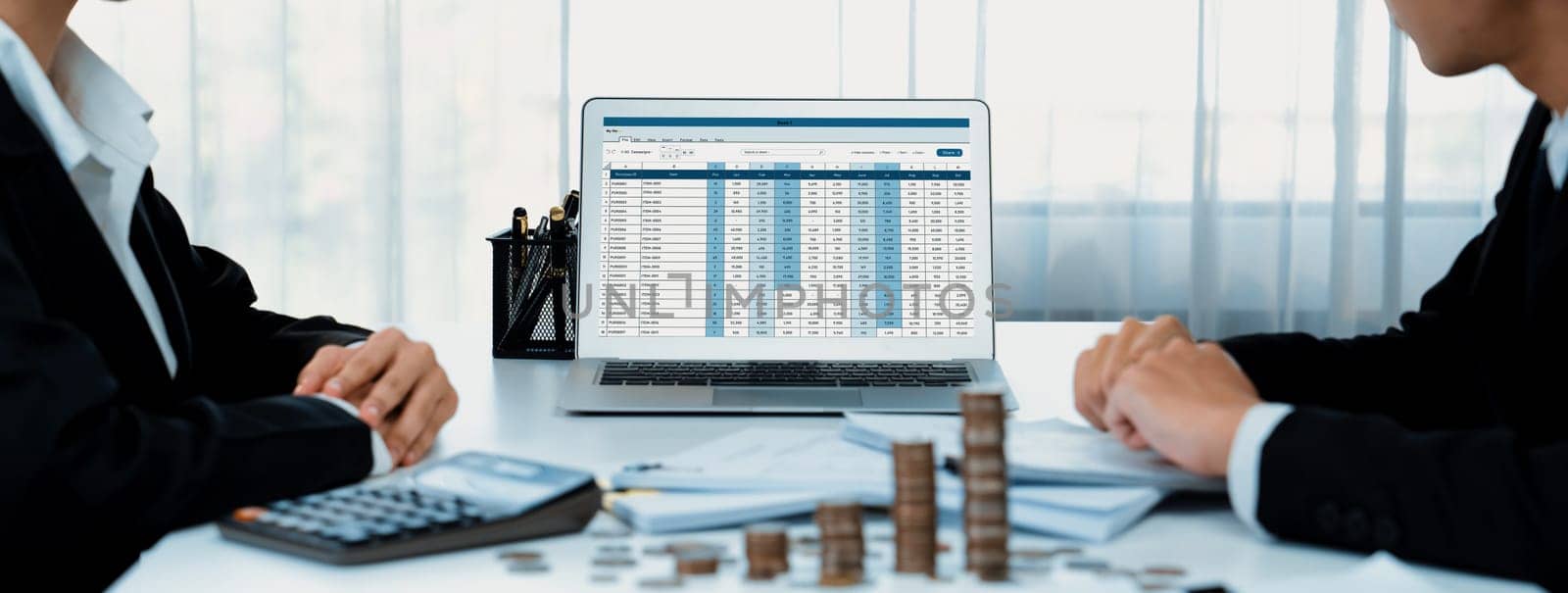 Corporate accountant use accounting software on laptop to calculate and maximize tax refunds and improve financial performance with business investment concept of growth stack coin in panorama. Shrewd