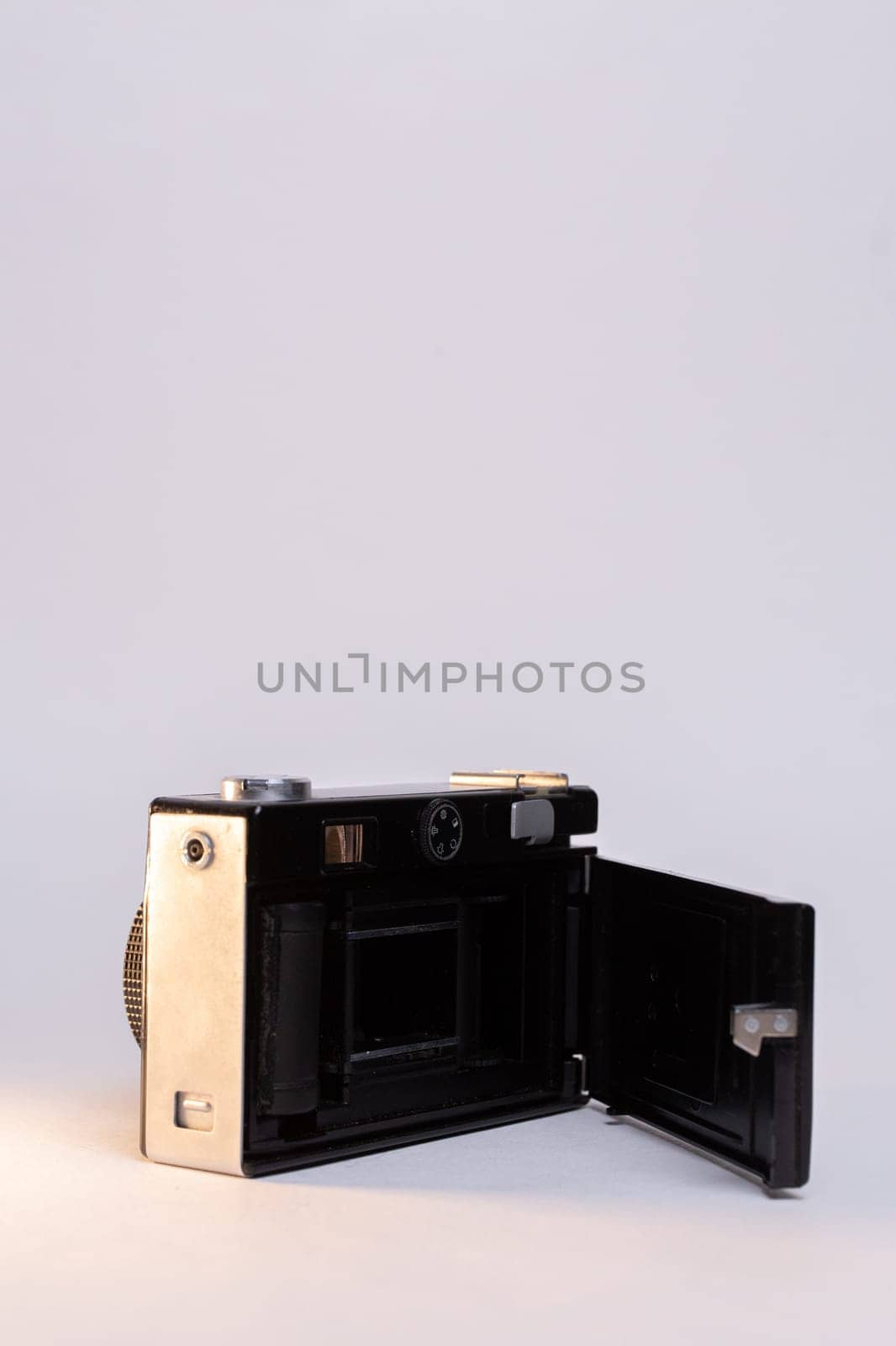 Black vintage camera isolated on white background by Pukhovskiy