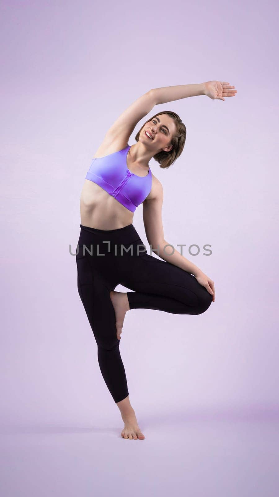 Full body length gaiety shot athletic and sporty woman doing healthy and meditative yoga exercise workout posture on isolated background. Healthy active and body care lifestyle