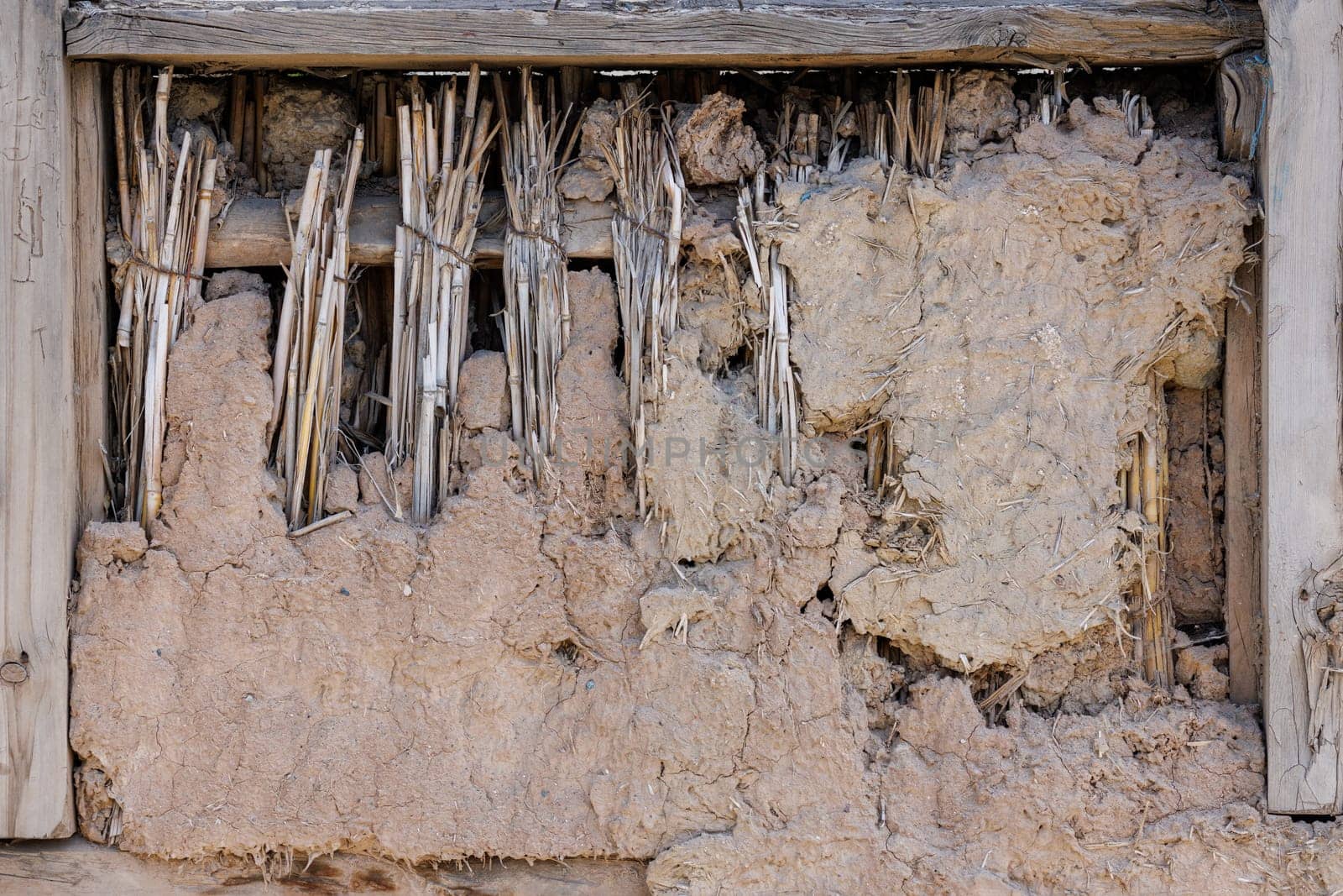 old damaged wattle and daub covered window, full-frame background and texture.