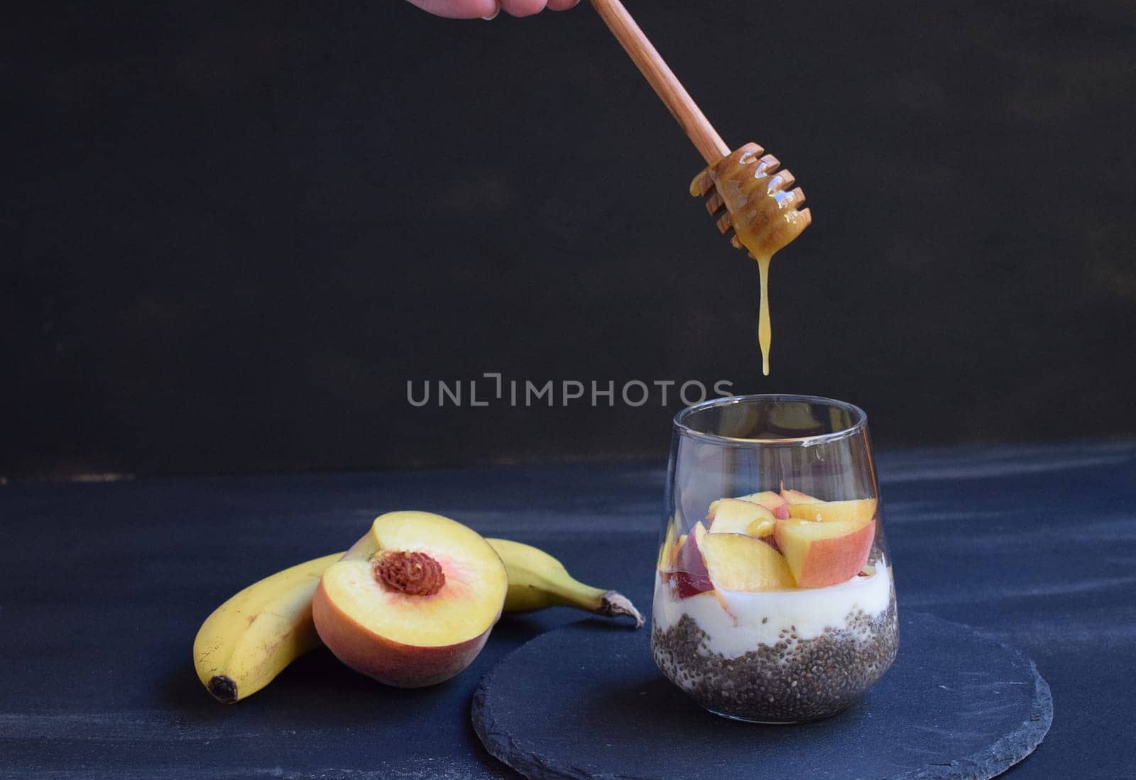 Healthy breakfast with chia seeds, yogurt, fruit and honey by artemisagajda