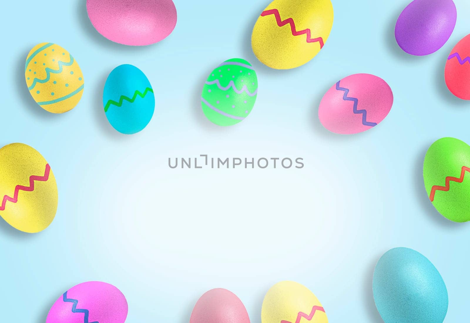 Colorful Easter eggs on pastel blue background. Copy space in center