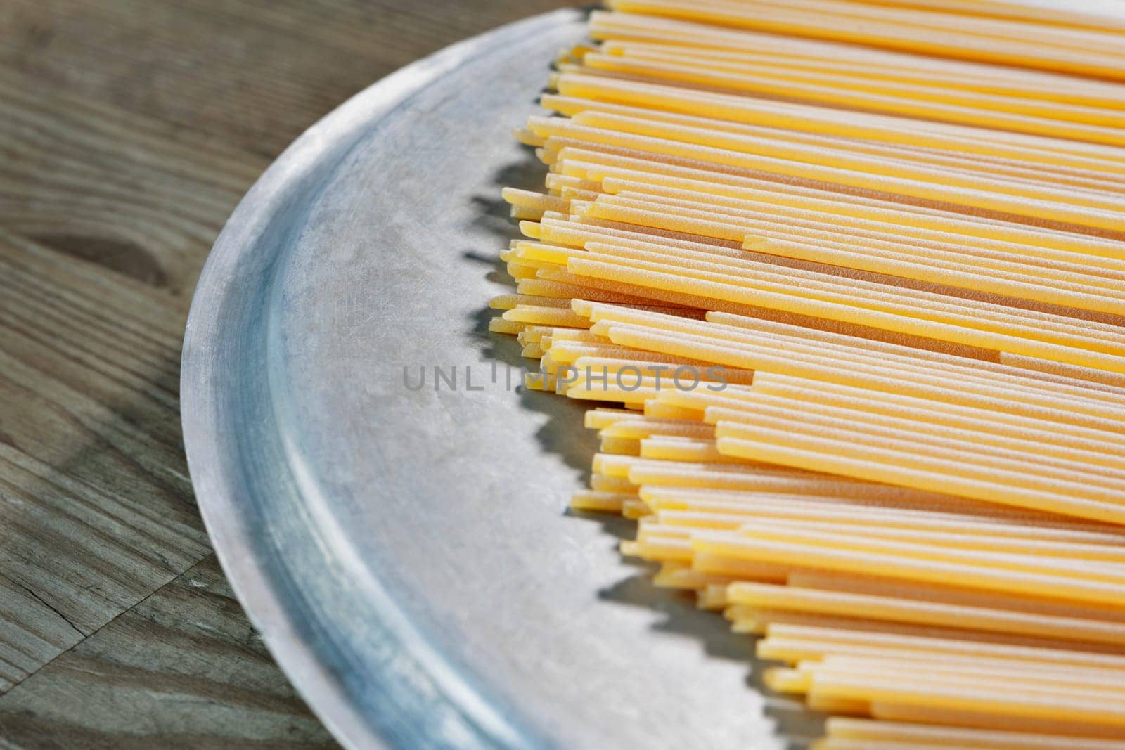 Dried pasta spaghetti on table  , preparing food , traditional italian food