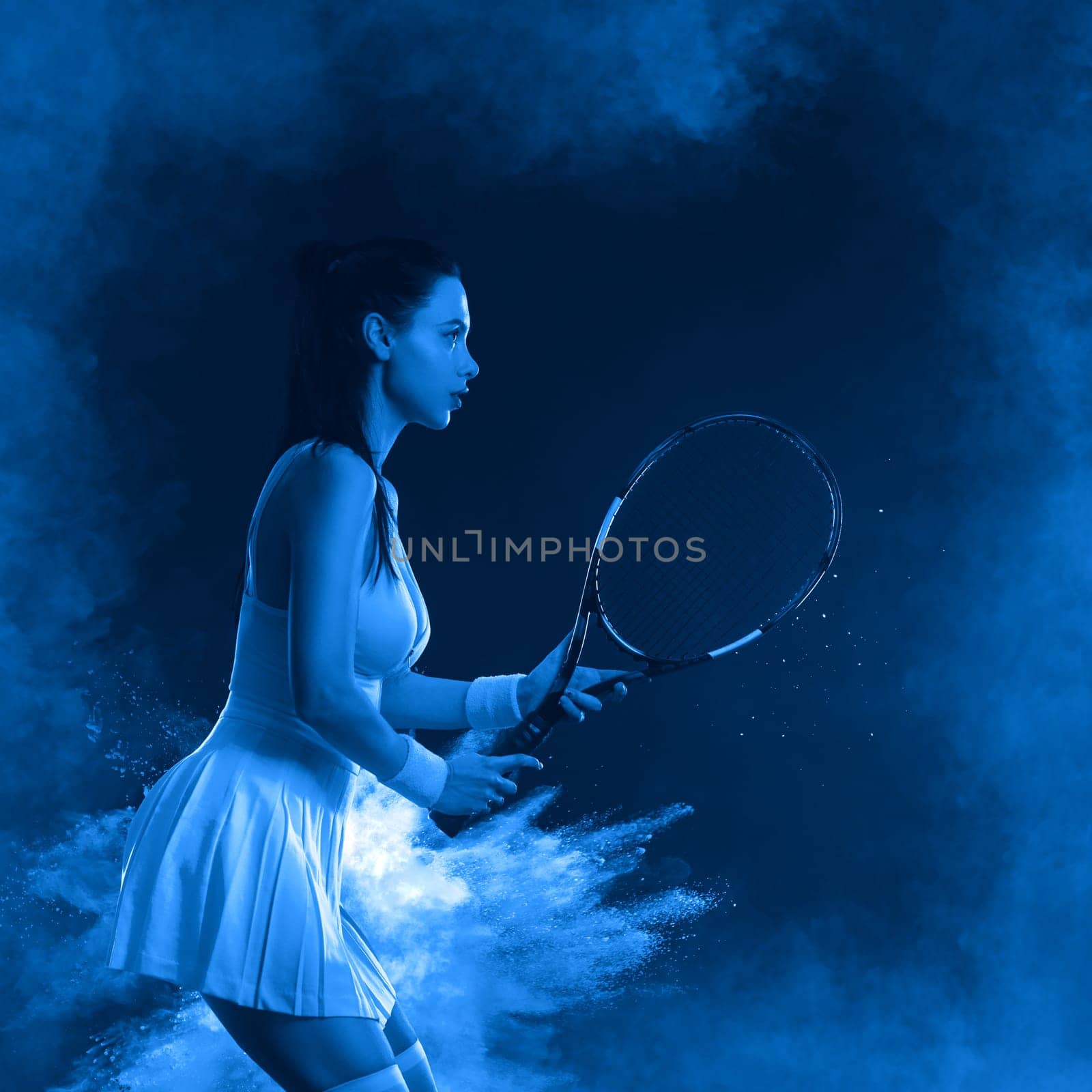 Tennis player with racket. Girl teenager athlete with racket on court with neon colors. Sport concept. Download a high quality photo for the design of a sports app or betting site