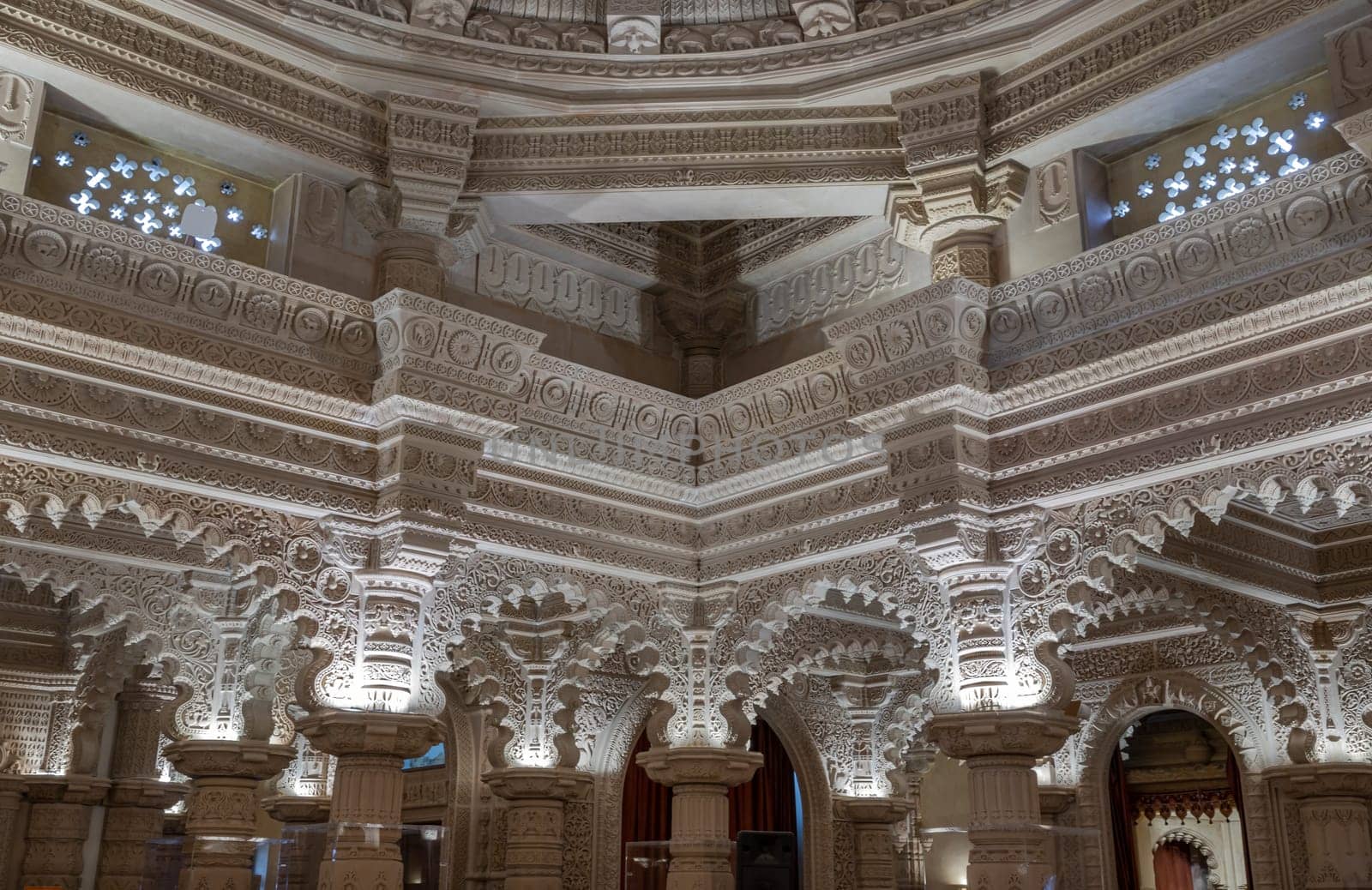 London, UK - Feb 27, 2024 - The Shree Sanatan Hindu Mandir Hindu temple interior architecture with view of intricately carved stone and columns with beautiful artwork. Inside the Shri Sanatan Hindu Temple, Space for text, Selective focus.