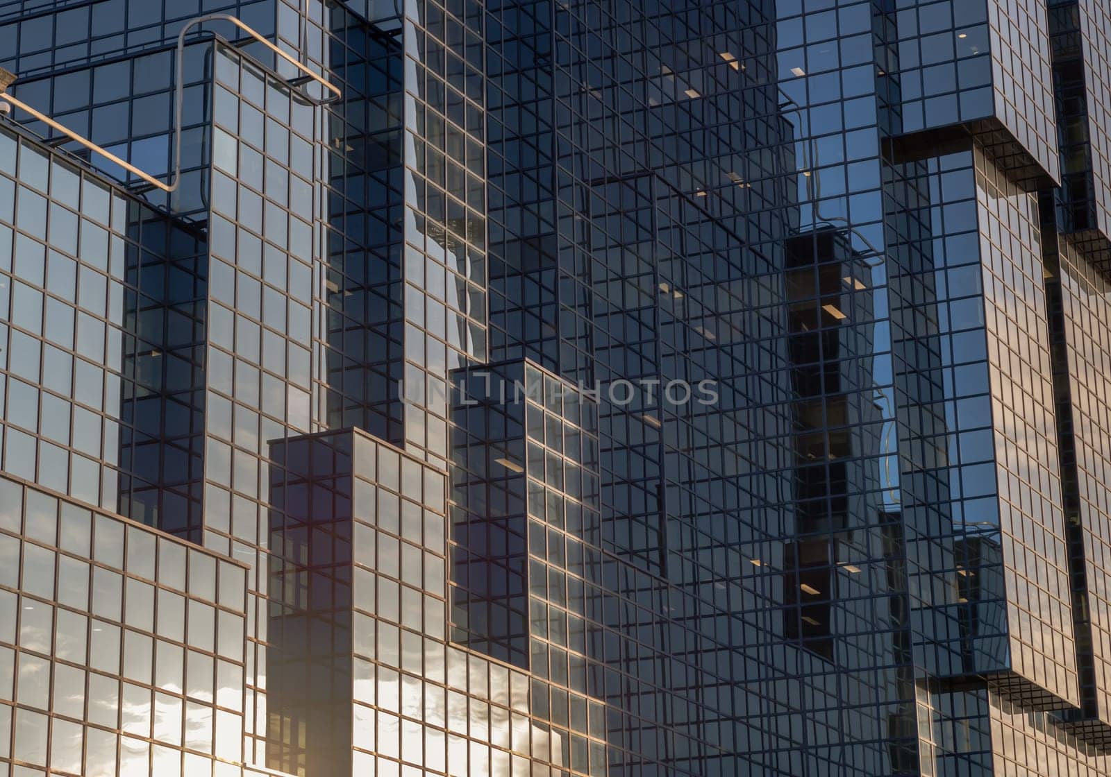 London, UK - Feb 27, 2024 - Architecture exterior of Modern building with many glass windows reflecting the sky. Northern & Shell Headquarters on the bank of the River Thames, Concept of successful business, Copy space, Selective focus.