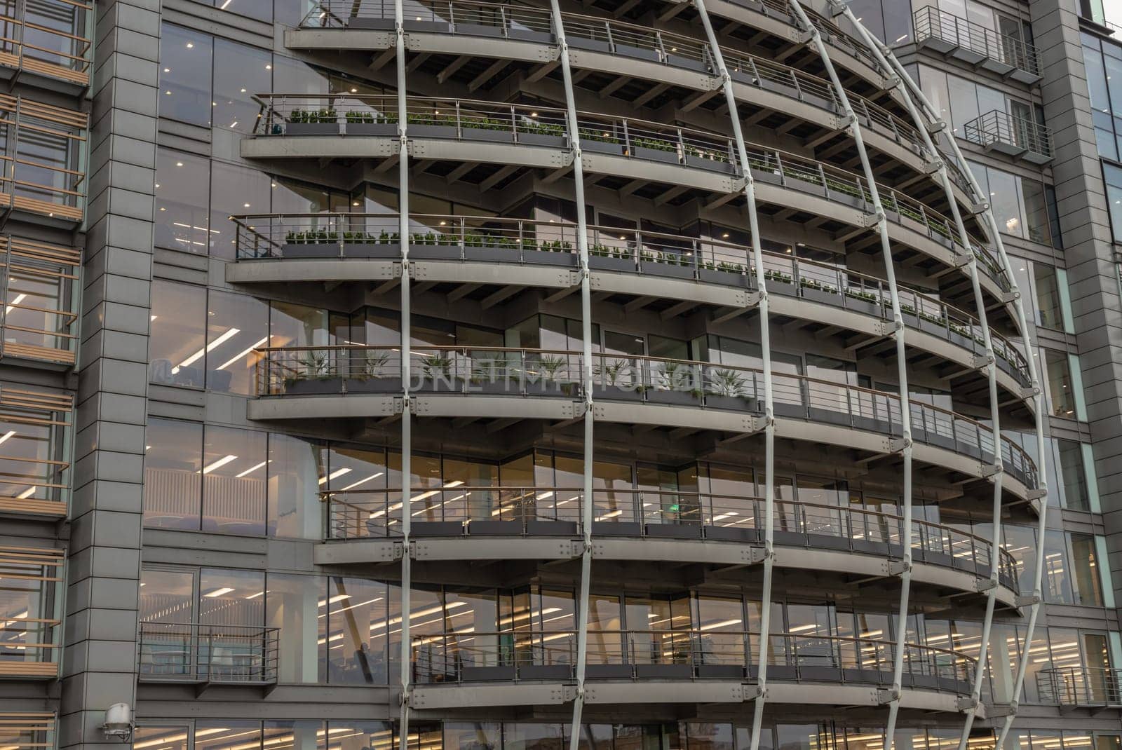 London, UK - Feb 27, 2024 - Modern architectural design of Riverside House. Exterior detail of Curved building along the River Thames of the City of London. Copy space, Selective focus.